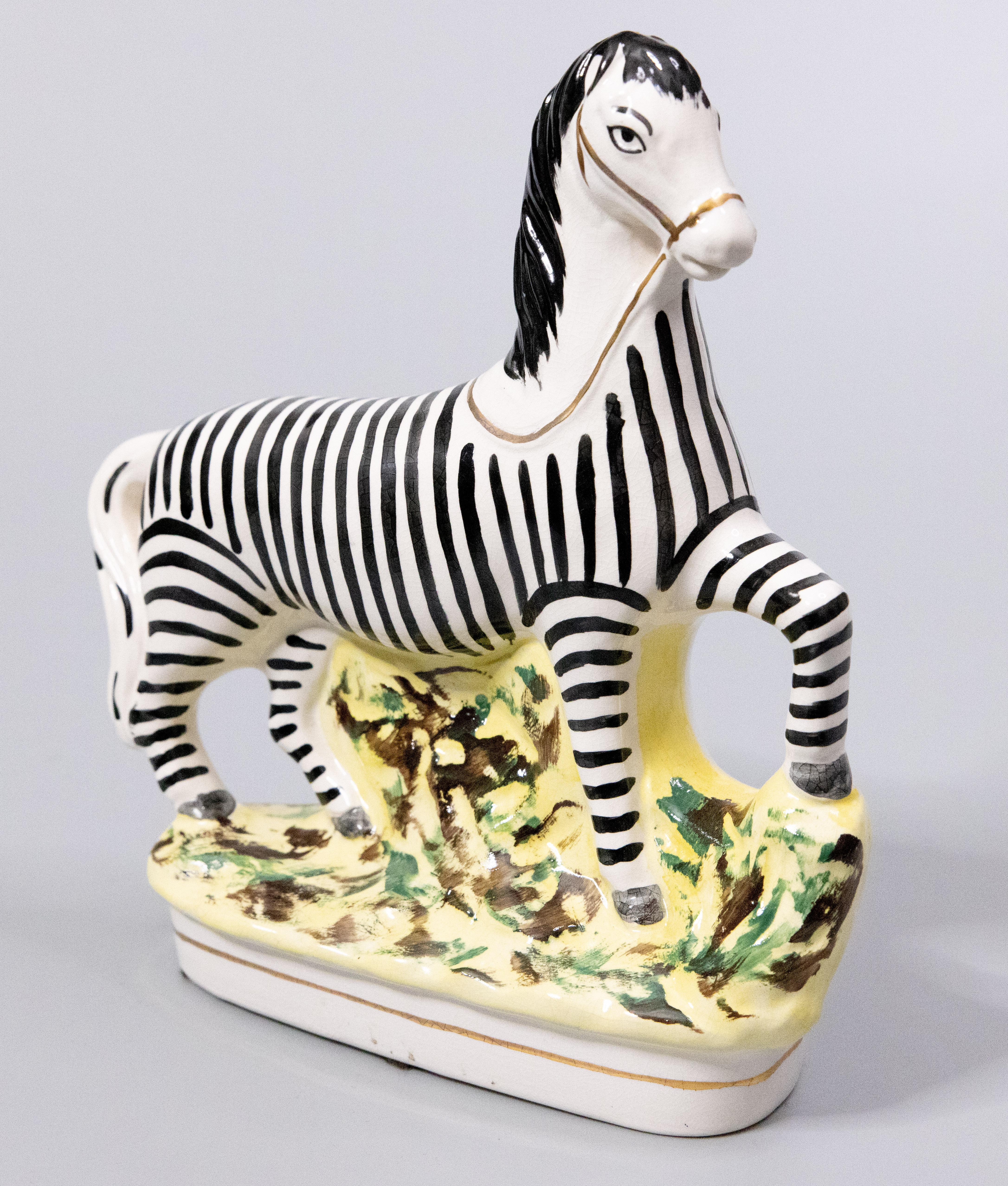 A superb 19th-century English Staffordshire prancing zebra figurine. This charming zebra is hand painted with fine details and would be perfect for display or added to a collection.