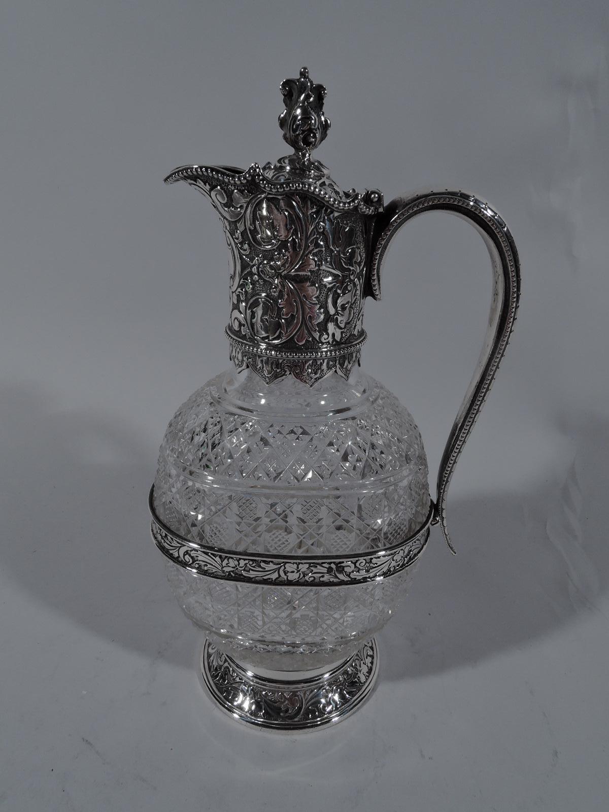 Victorian brilliant-cut decanter with sterling silver mounts. Made by Horace Woodward & Co., Ltd in London in 1894. Round and flat body with dense diaper ornament. Cylindrical neck in sterling silver collar with helmet mouth. Cover hinged with
