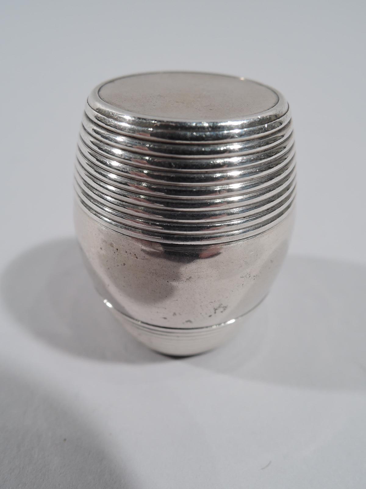 English sterling silver nutmeg grater, early 19th century. Barrel form with reeded top and bottom; cover threaded. Detachable grill. Maker’s mark.