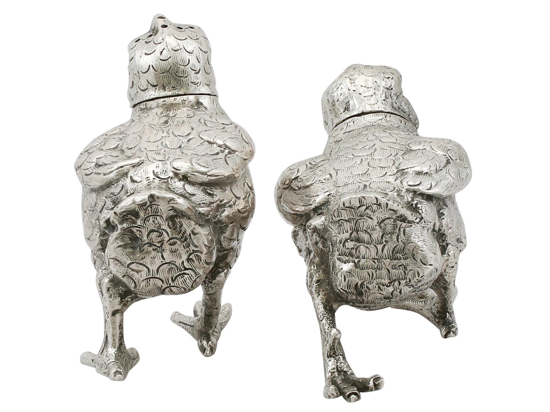 An exceptional, fine and impressive pair of antique George V English cast sterling silver pepper shakers modeled in the form of chicks; an addition to our silver cruets or condiments collection

These exceptional antique George V cast sterling
