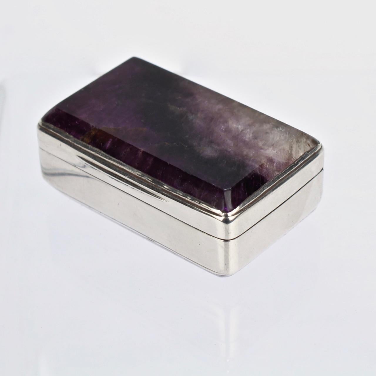 A very rare Victorian sterling silver snuff box inset with bluejohn (or Derbyshire spar) panels to the base and lid.

The interior rim bears hallmarks for Joseph Willmore, Sheffield, sterling and 1840.

Simply a rarity and significant addition to