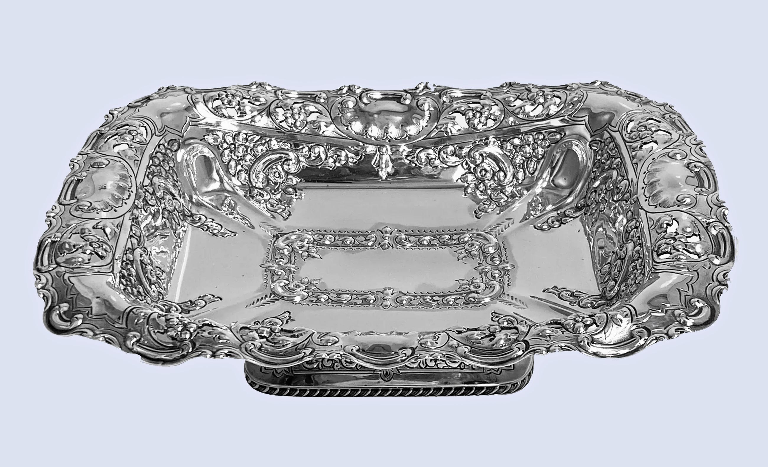 Antique English sterling silver Fruit Dish hallmarked Sheffield 1898 John Round. The rectangular shape Dish on pedestal foot with gadroon and foliage border, the bowl itself with richly decorated chased embossed and engraved foliage fruit decoration