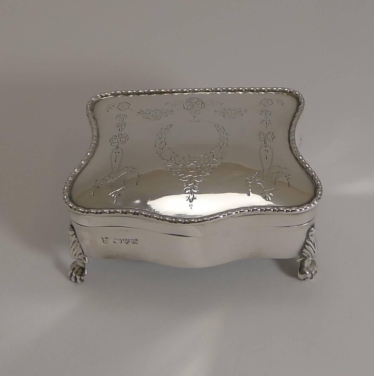 A beautifully shaped Jewelry box standing on four lovely lion's paw feet all made from English sterling silver fully hallmarked for the highly sought-after Chester assay office and the year 1911; the makers initials are also present, G.N over R.H