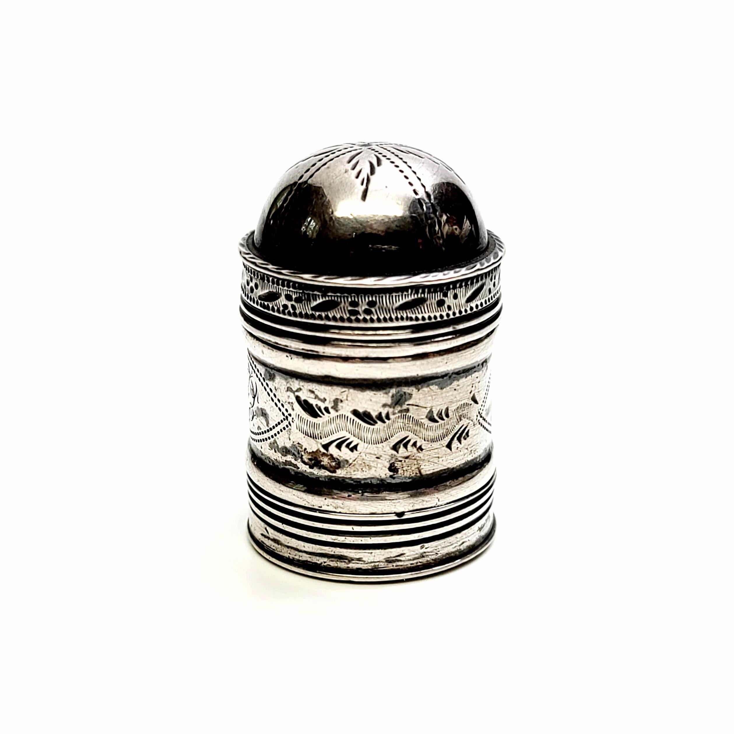 Antique English sterling silver nutmeg grater, circa 1799.

Crafted by English silversmith John Turner, this nutmeg grater comes apart into 3 pieces. The domed lid has an etched leaf design, as well as an etched design around the canister. There