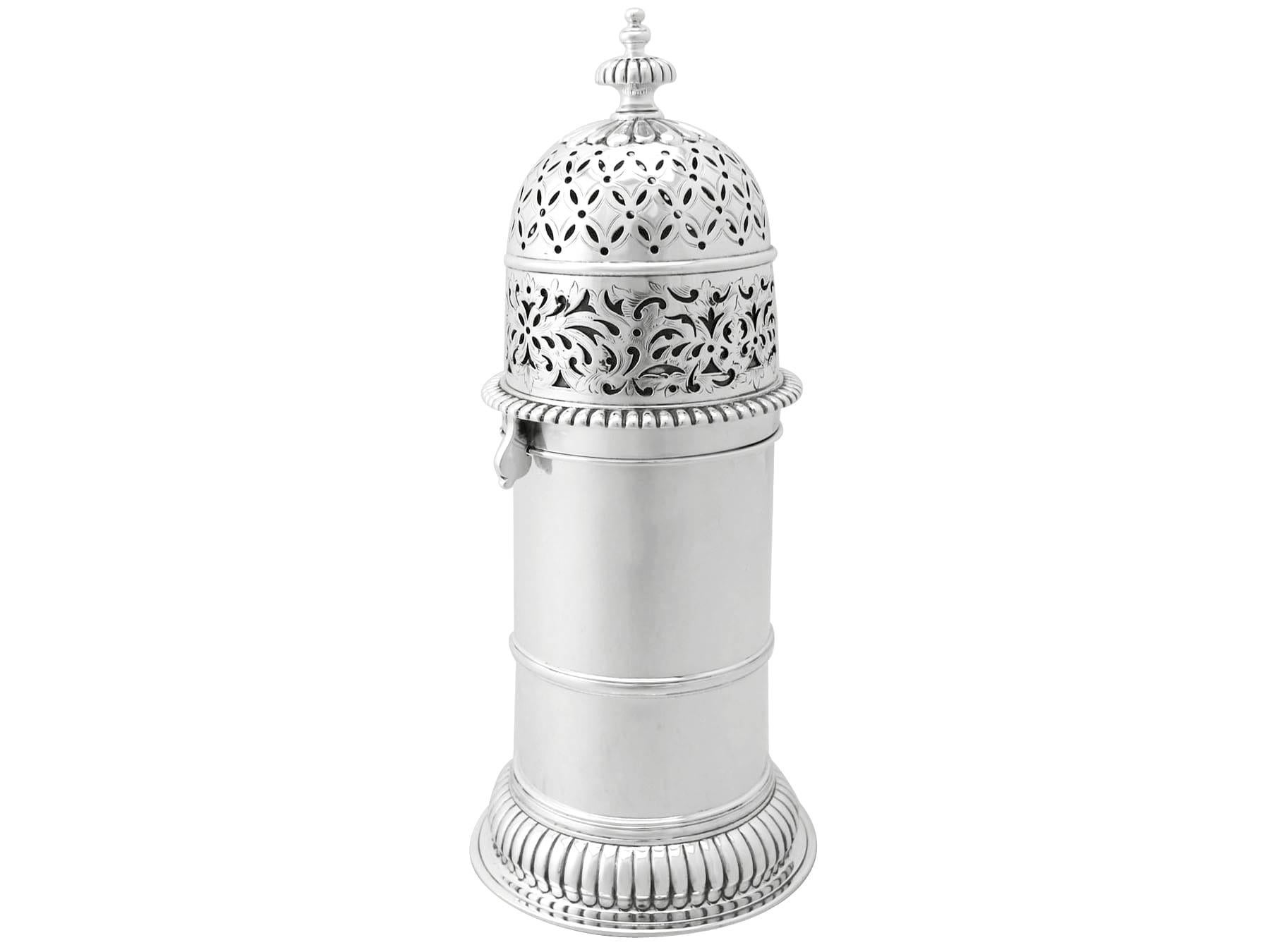 A magnificent, fine and impressive, large antique George V English sterling silver lighthouse style caster, part of our silverware collection.

This magnificent and large antique George V English sterling silver sugar caster has a cylindrical form