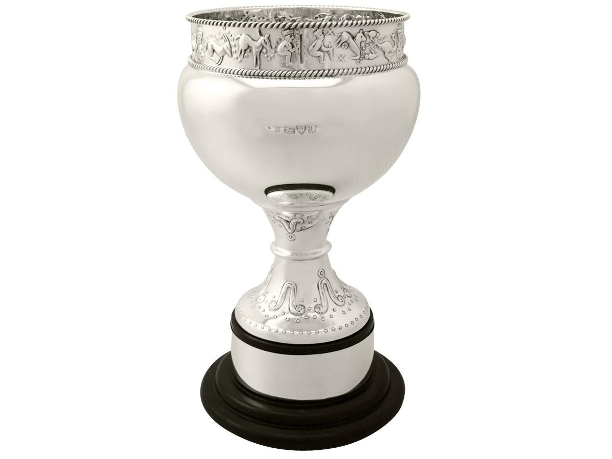 A fine and impressive antique George V English sterling silver presentation cup in the Arts & Crafts style; an addition to our engravable presentation silverware collection

This fine antique George V sterling silver presentation cup has a plain