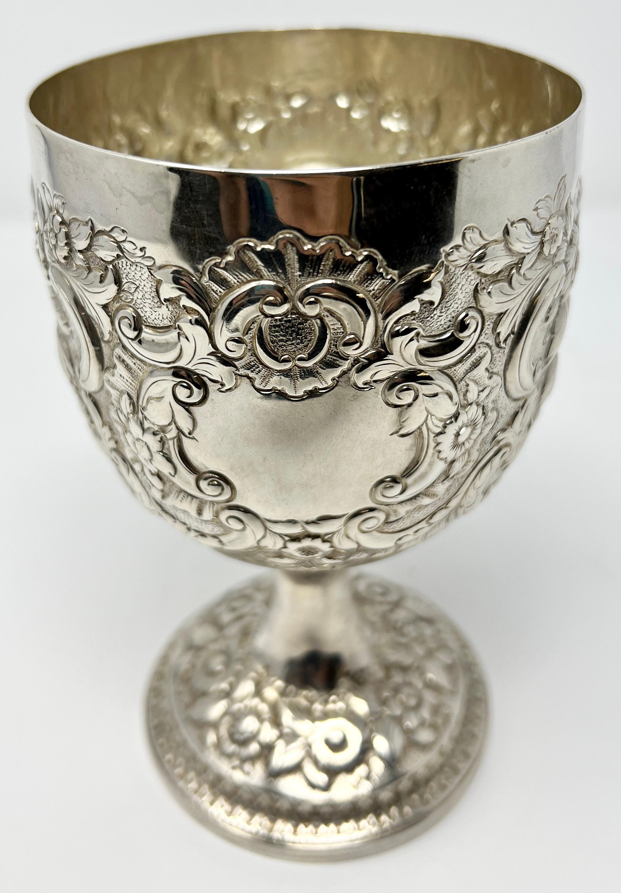 Antique English sterling silver repoussé goblet.