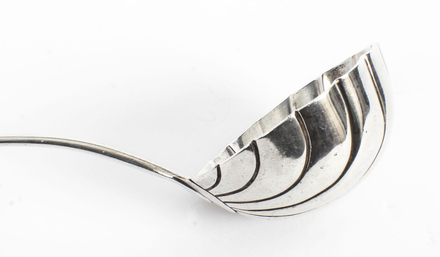 This is an exquisite English sterling soup ladle, with hallmarks for London 1959 and the maker's mark of the renowned London silversmith C.S.Harris & Sons Ltd.

Add a touch of classical elegance to your next dining experience with this lovely