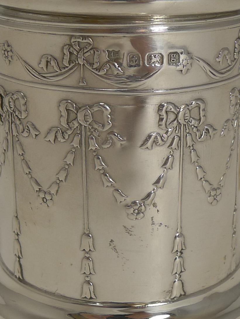 A stunning little string or twine box or dispenser made from English sterling silver with fabulous ribbon and bow garland decoration.

There is a full English hallmark for Birmingham 1906, Edwardian in era. The makers mark I believe is for Henry
