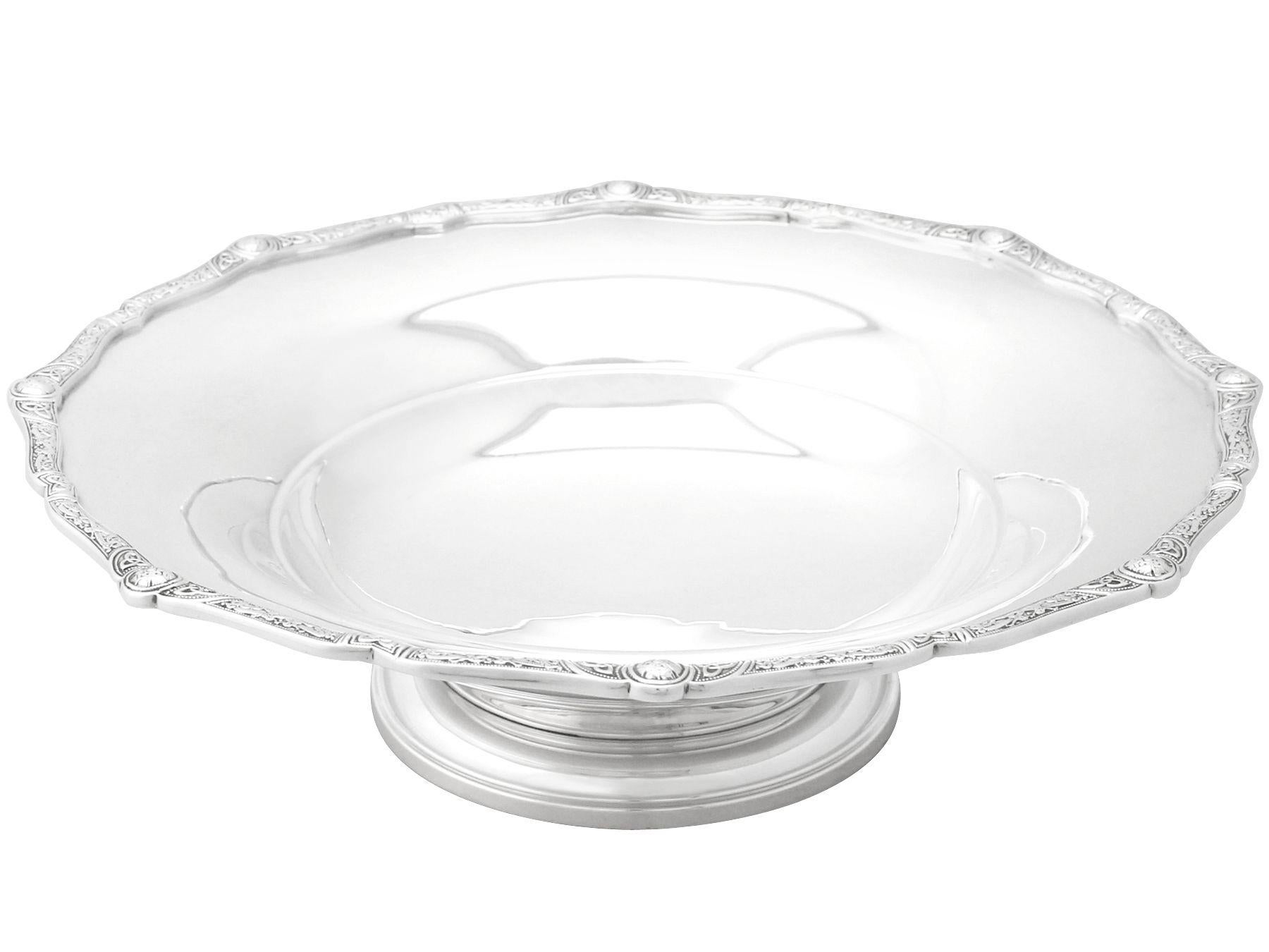 An exceptional, fine and impressive antique George V English sterling silver dish or tazza in the Lindisfarne style; an addition to our ornamental silverware collection.

This exceptional antique George V sterling silver dish or tazza has a