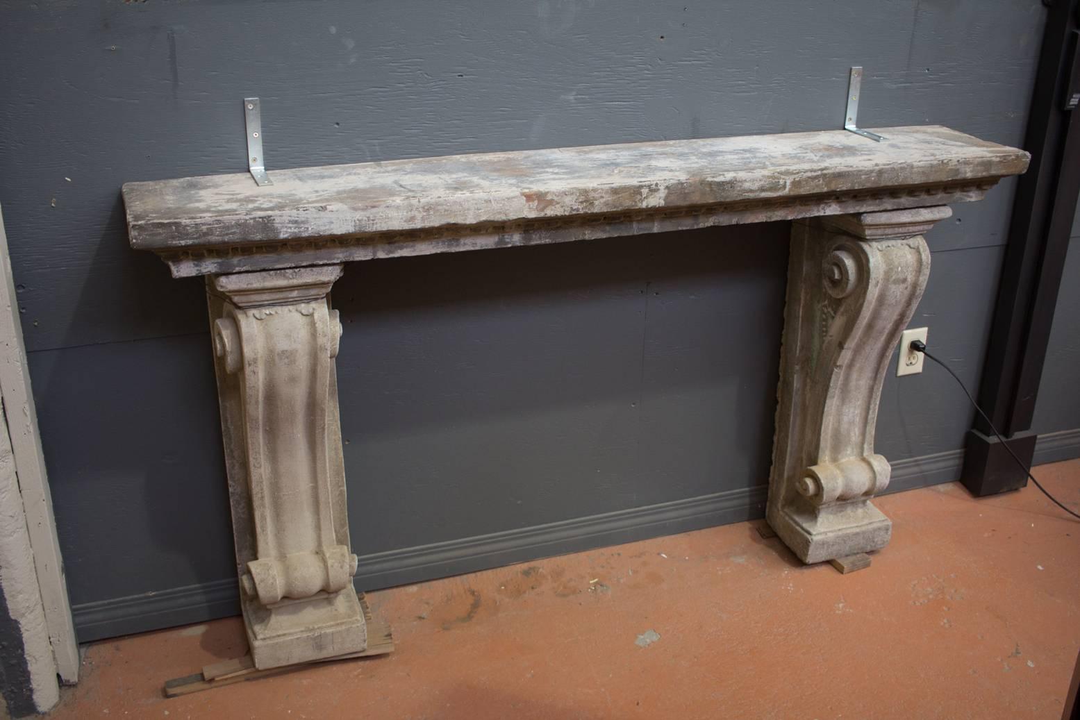 Antique composite stone console table with decorative corbels. Could also be used as a fireplace surround. Wonderful patina and texture.