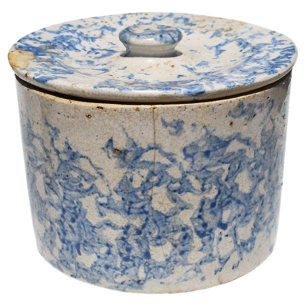 A charming antique English ceramic earthenware salt crock in blue and cream with its original lid. This provincial-style pot was created by hand, in the late 1800s to early 1900s. It is round and quite heavy as most stoneware is. Often referred to