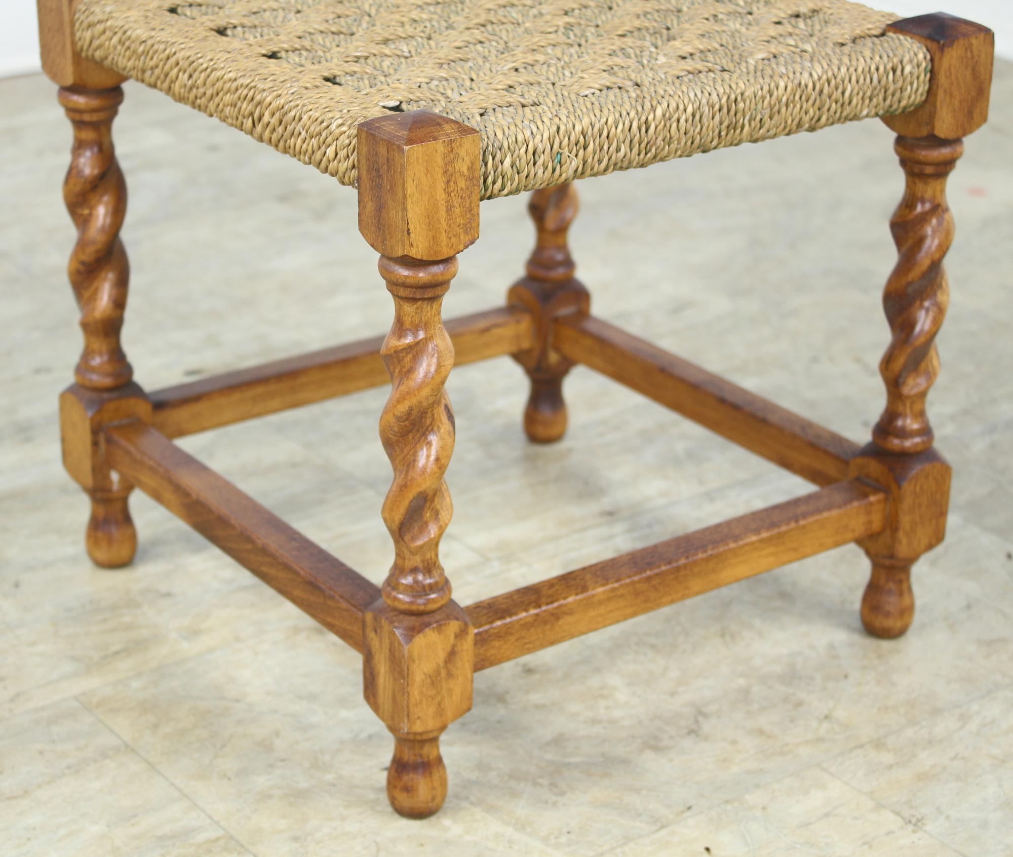 A sweet little string stool, perfect for the bedroom, living room or as a perch by the fireplace. Beautiful barley twist legs. Pretty!