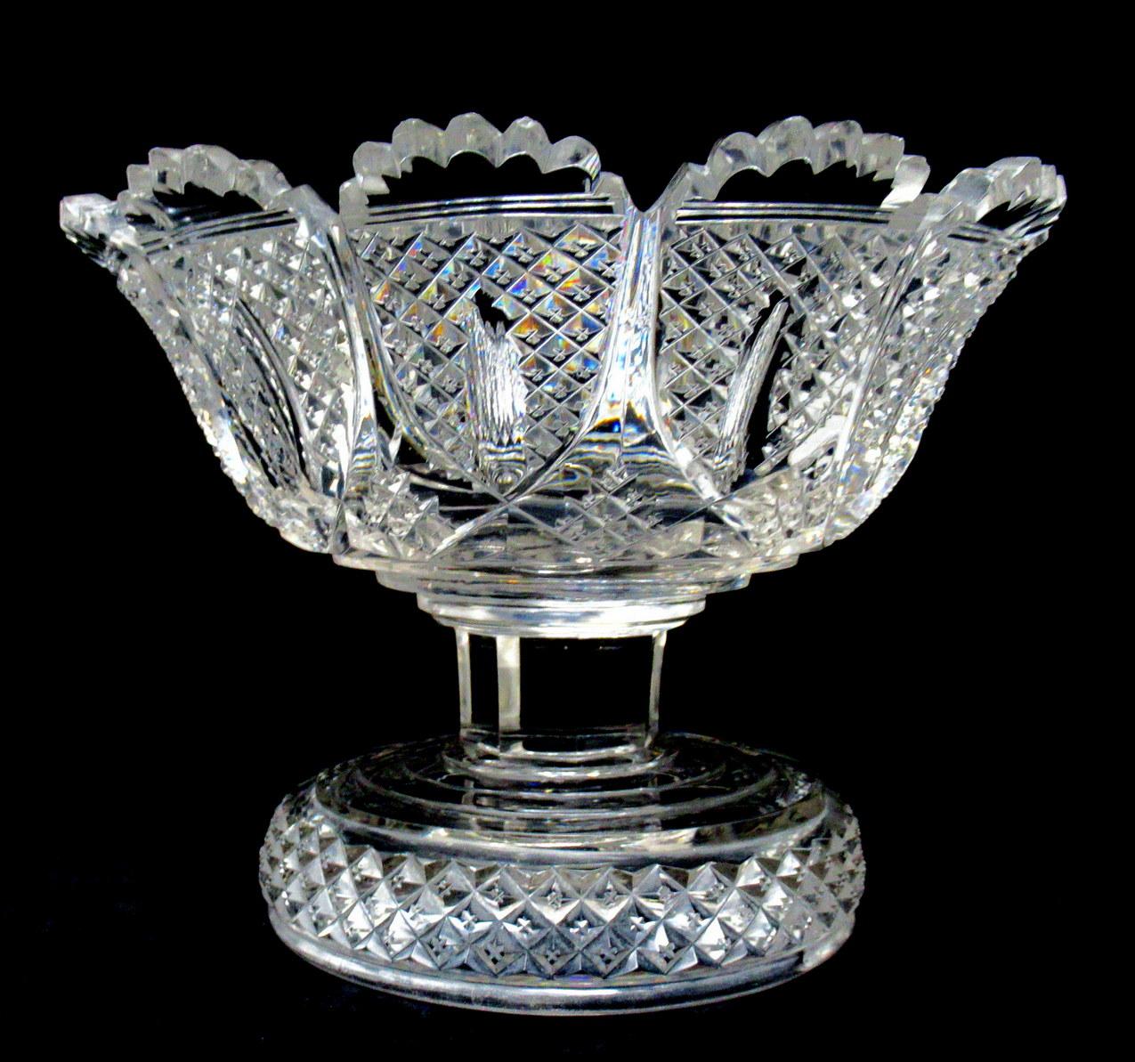 Stunning and Extremely Rare English heavy gauge hand cut full lead crystal fruit bowl or centerpiece of traditional outline, of outstanding quality and condition. Circa 1840 - 1860. 

The unusual fan-cut decorative rim above a deep cut diamond