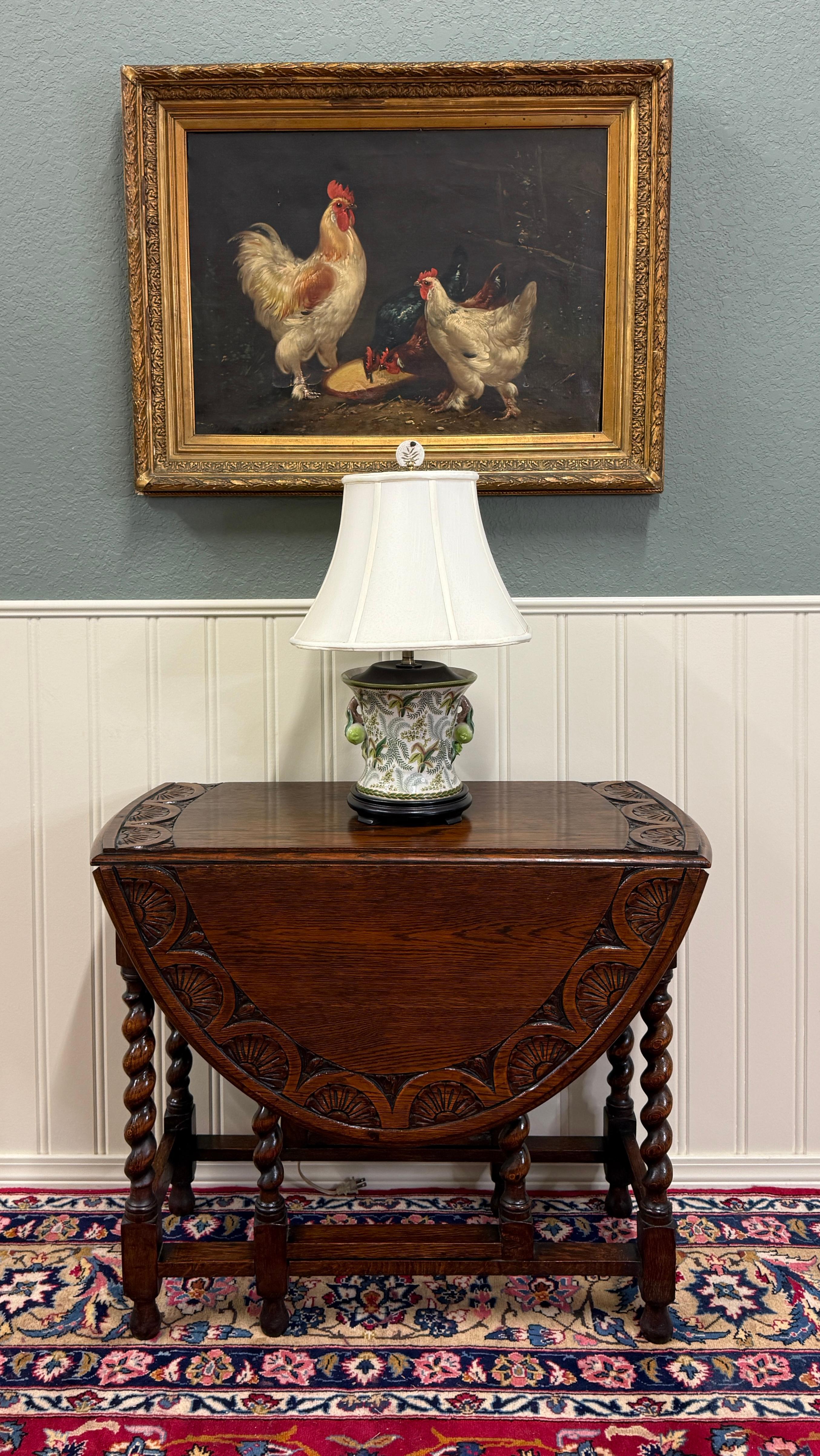 CHARMING Antique English Oak Carved Top Drop Leaf  Gateleg Oval Table ~~Barley Twist Legs and Carved Top ~~c. 1920s-1930s  

        Always in high demand

        Solid and sturdy with very nice oak patina 

        Versatile size
        28