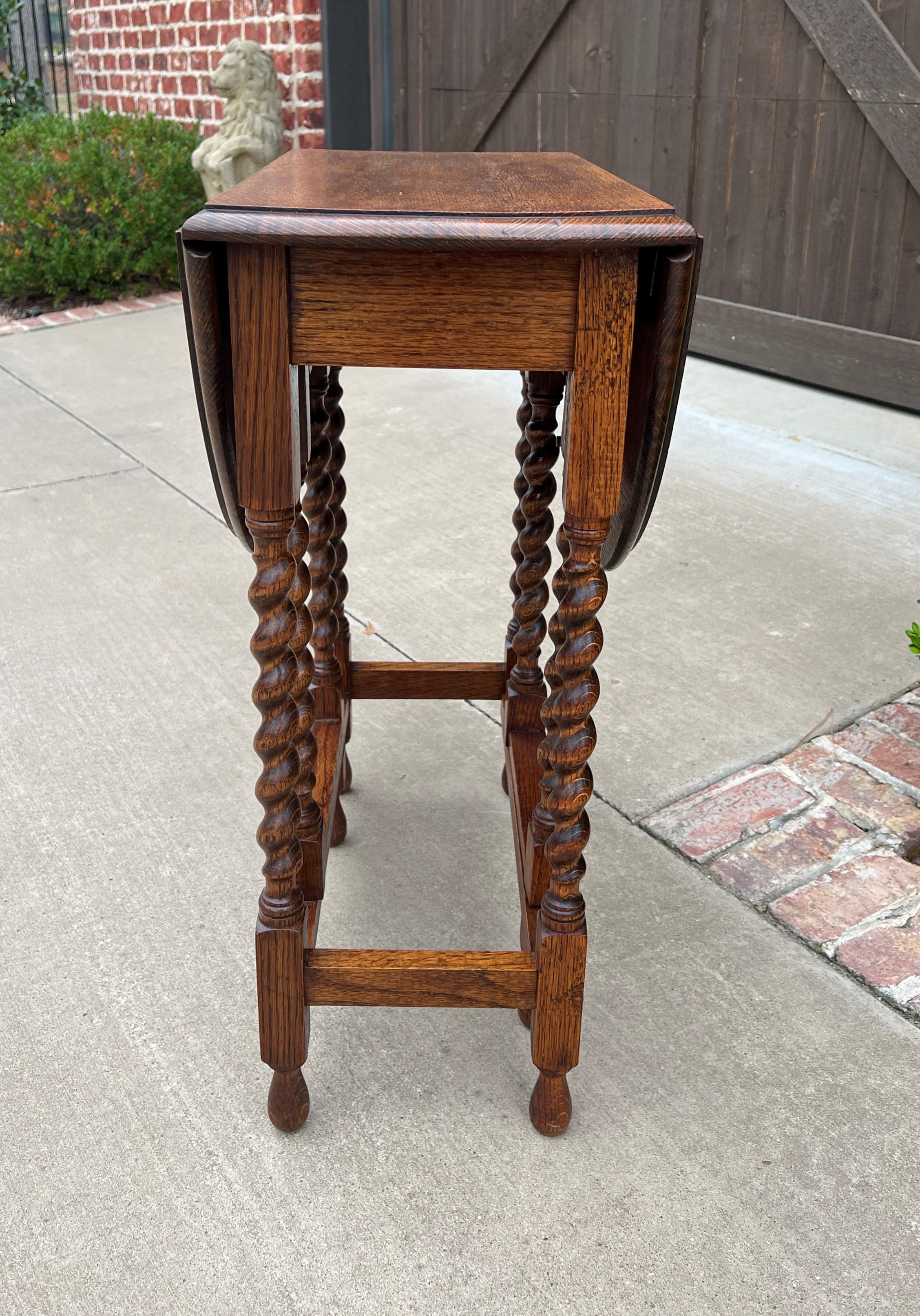 Charming and petite antique English honey oak drop leaf gateleg oval table with barley twist legs #1~~circa 1930s
Always in high demand~~hard-to-find petite size drop leaf gateleg table
Solid and sturdy~~nice oak patina
Measures: 28.25