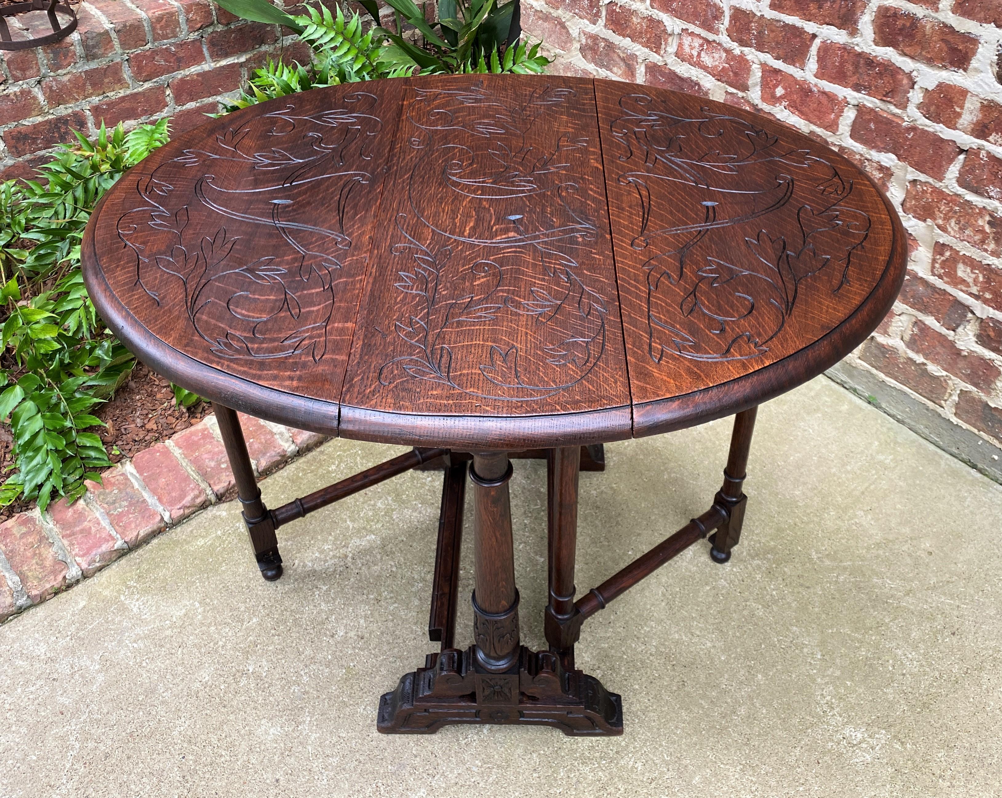 Antique English Table Drop Leaf Gateleg Turned Post Carved Top Trestle Base Oak In Good Condition For Sale In Tyler, TX