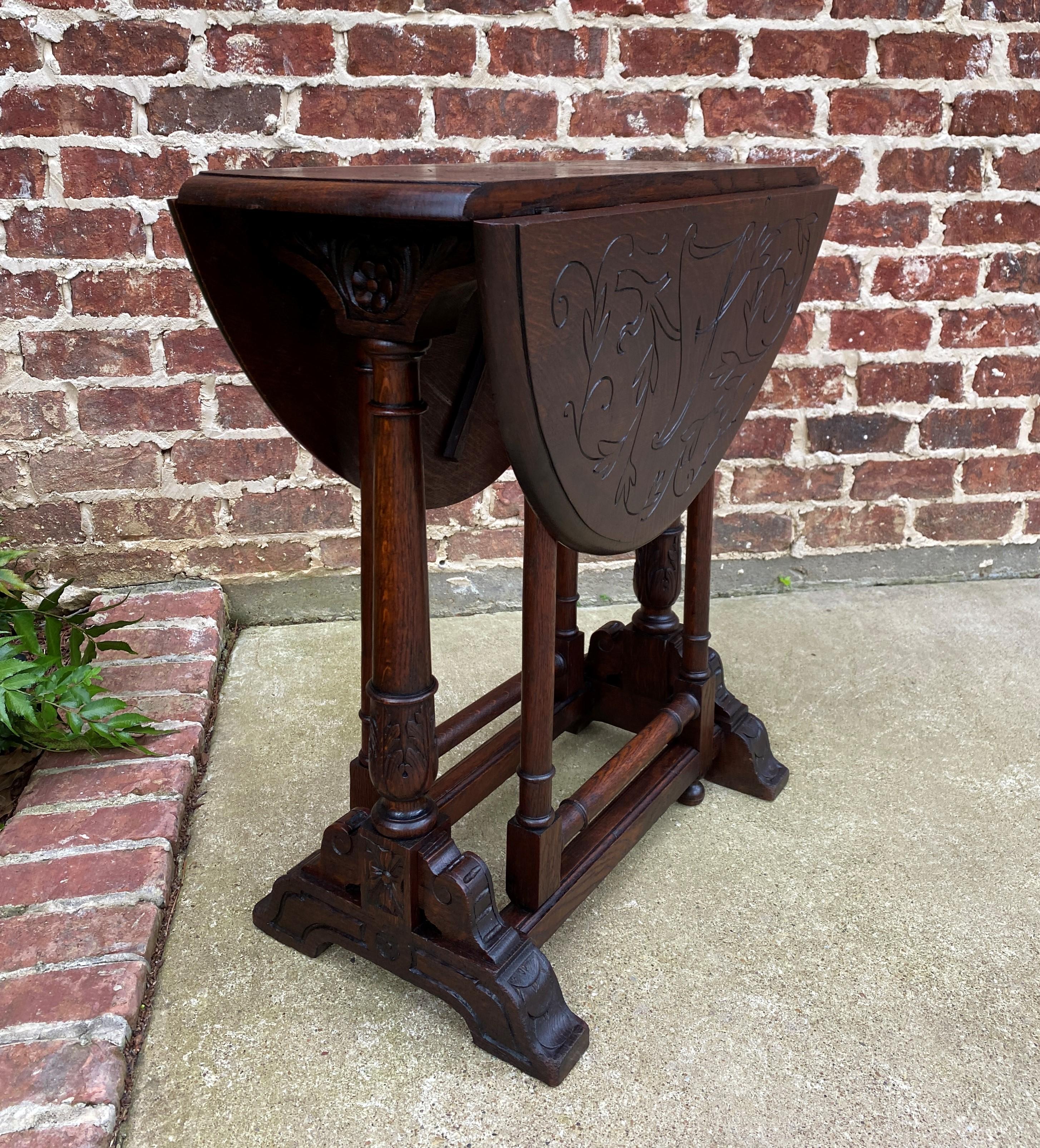Early 20th Century Antique English Table Drop Leaf Gateleg Turned Post Carved Top Trestle Base Oak For Sale
