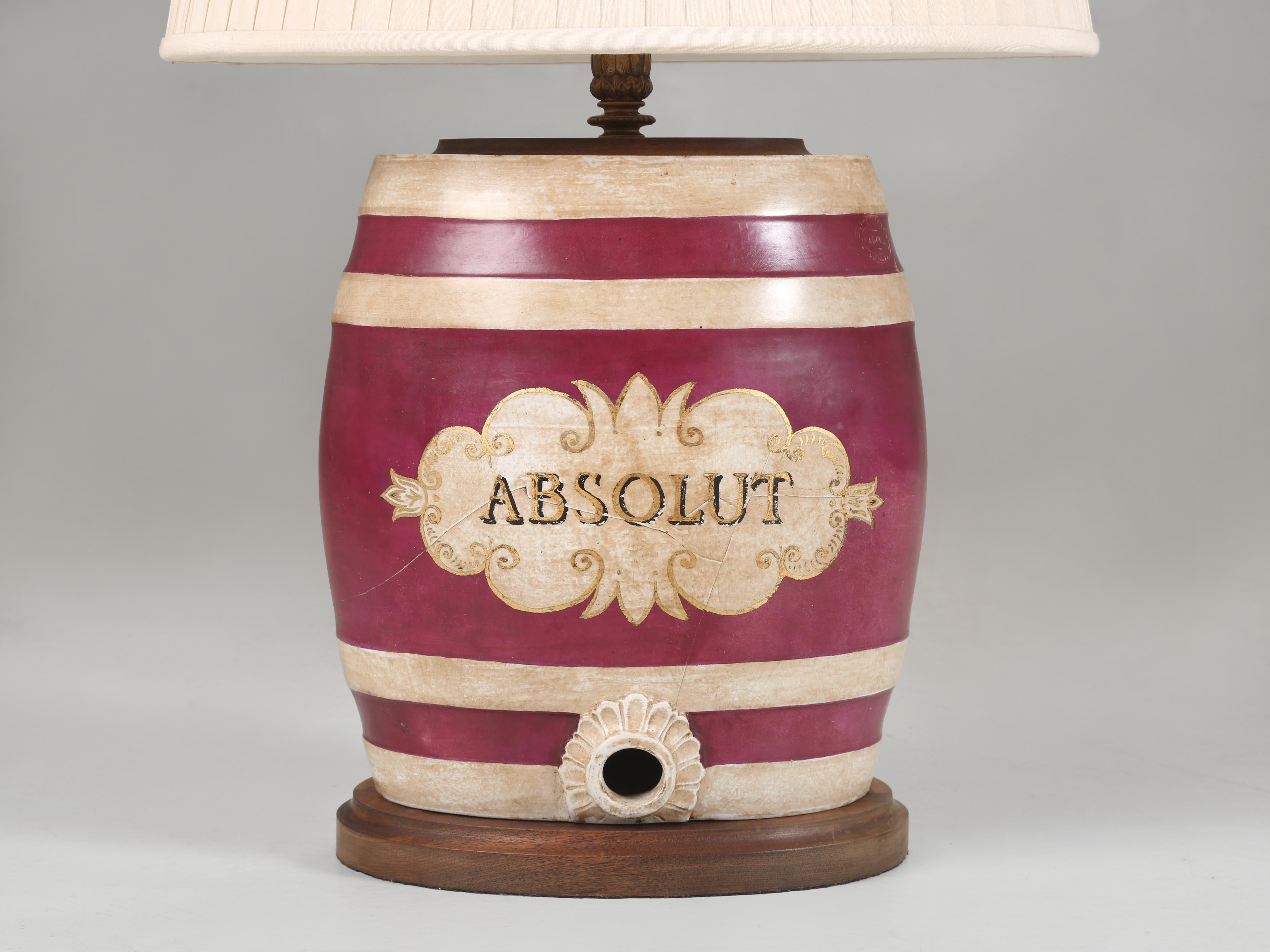 Antique English Liquor container and was converted into a Table Lamp in England showcasing Absolut Vodka. Exactly when it was converted to advertising Absolut is not exactly known, but certainly not much more than in the last 25-years. The