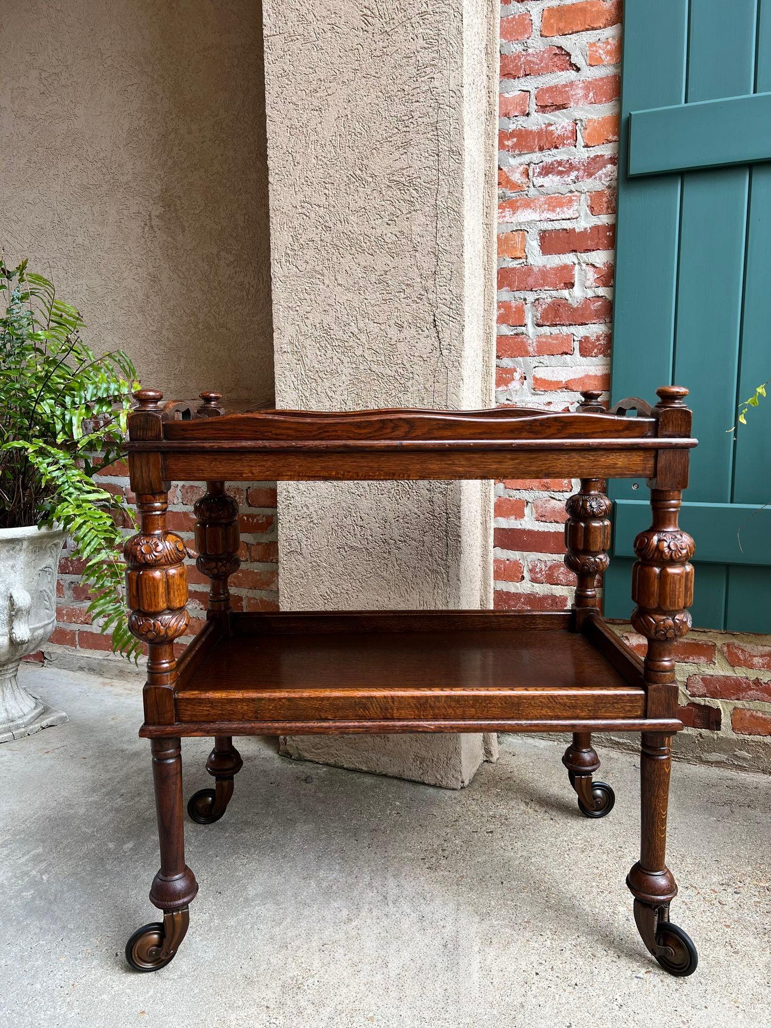 Antique English Tea Trolley Drinks Bar Cart Cocktail Tray Tudor Table Carved Oak.

Direct from England, a lovely antique English oak tea trolley or “dumbwaiter” serving cart and serving tray! Excellent for entertaining, as a drinks or dessert cart,