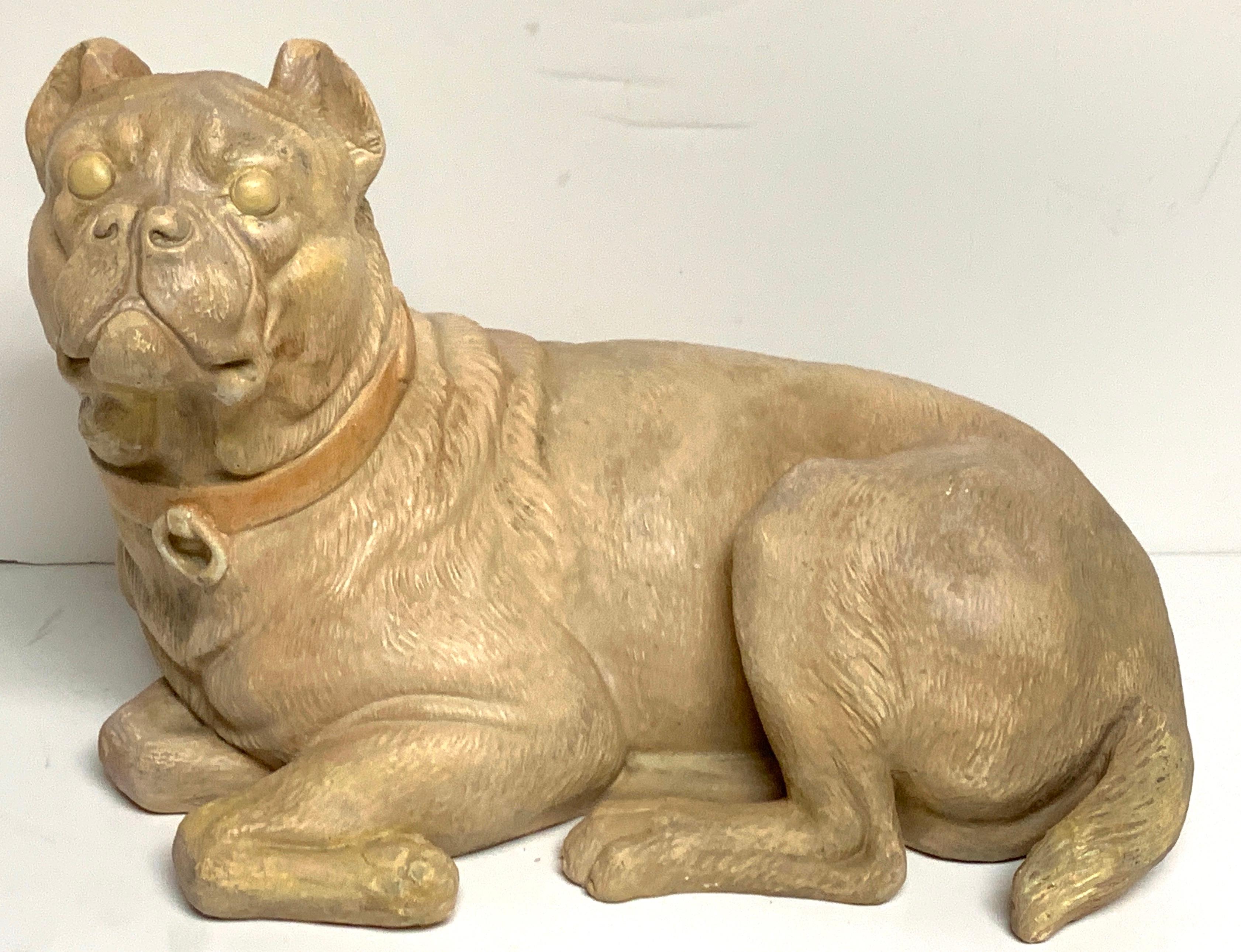 Antique English terracotta recumbent pug dog, realistically modeled and subtly polychromed. Rare form.