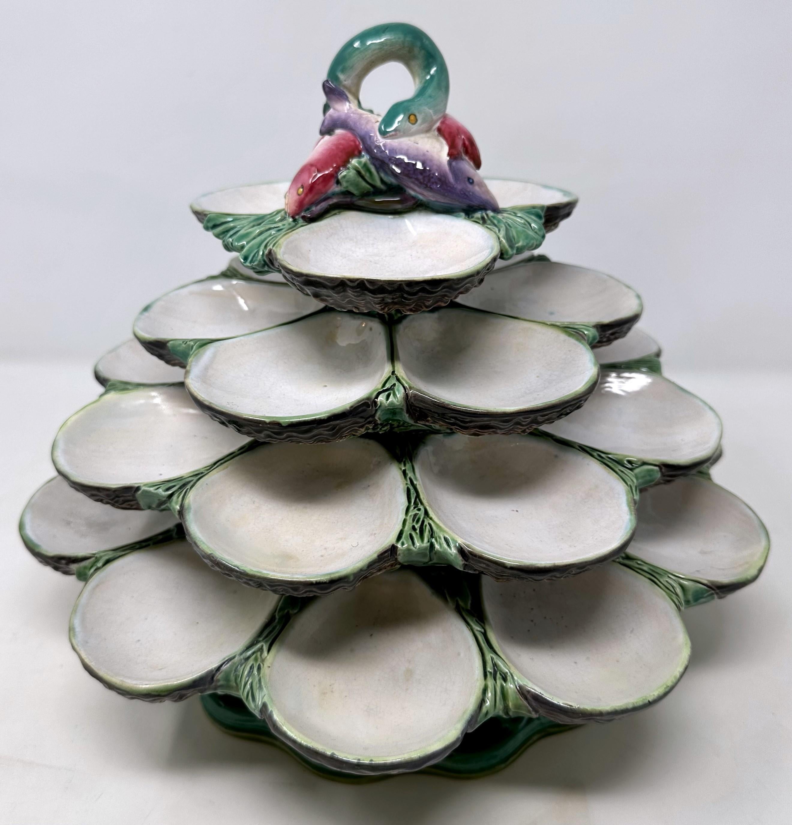 Rare Antique English Thomas Minton Majolica Porcelain Revolving 4 Tier Oyster Server, Circa 1870-1880.
Hand-Painted and Molded in the Art Nouveau Style with Colors of Blue, Green, Purple, Pink and Brown.
The revolving mechanism works beautifully and