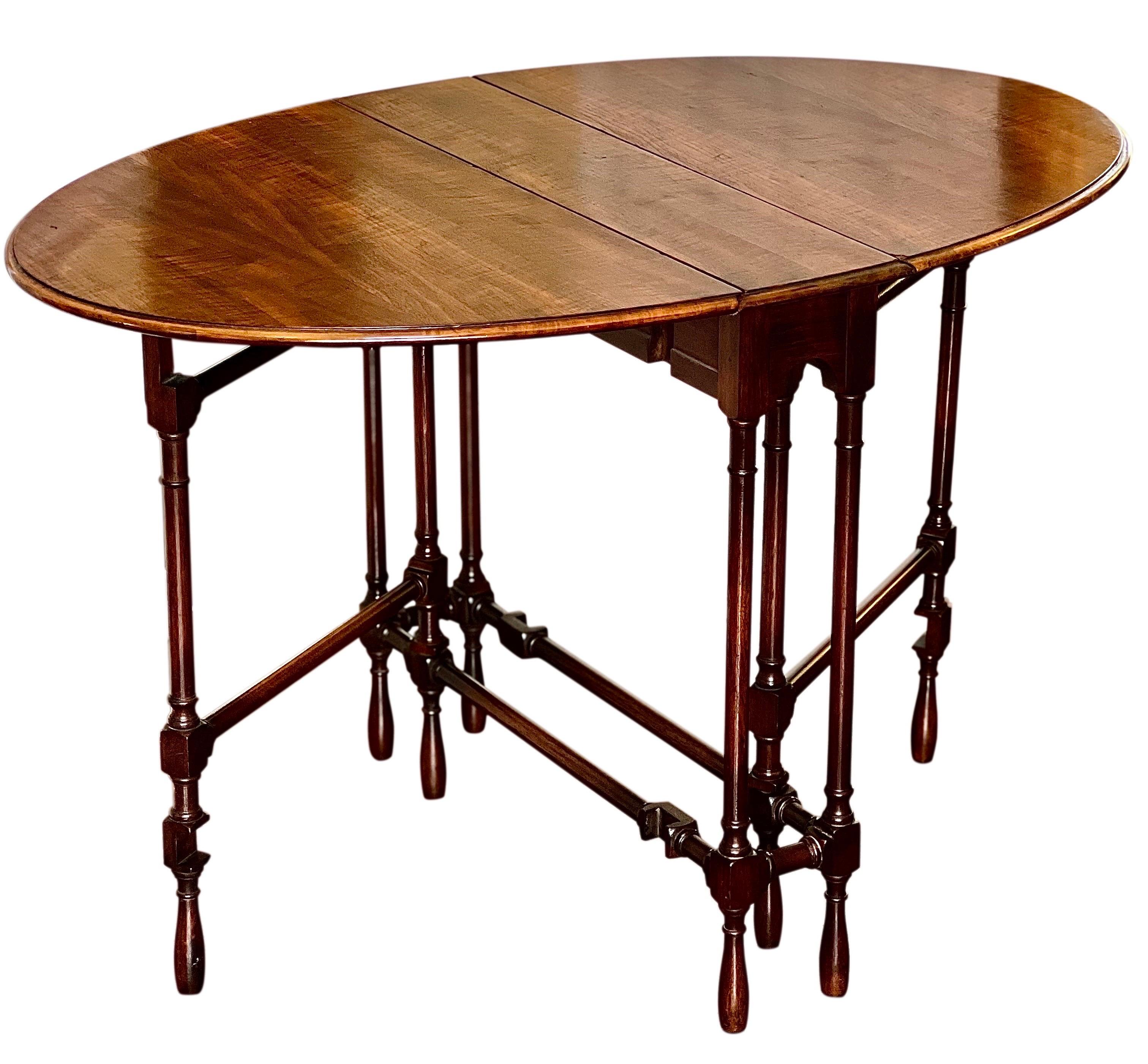 Antique English oak gate leg table, c. 1910’s.

Exceptional Jacobean style table in tiger oak with a uniquely slim profile. It features notably long leaves which extend to provide an amply sized tabletop of 40.75