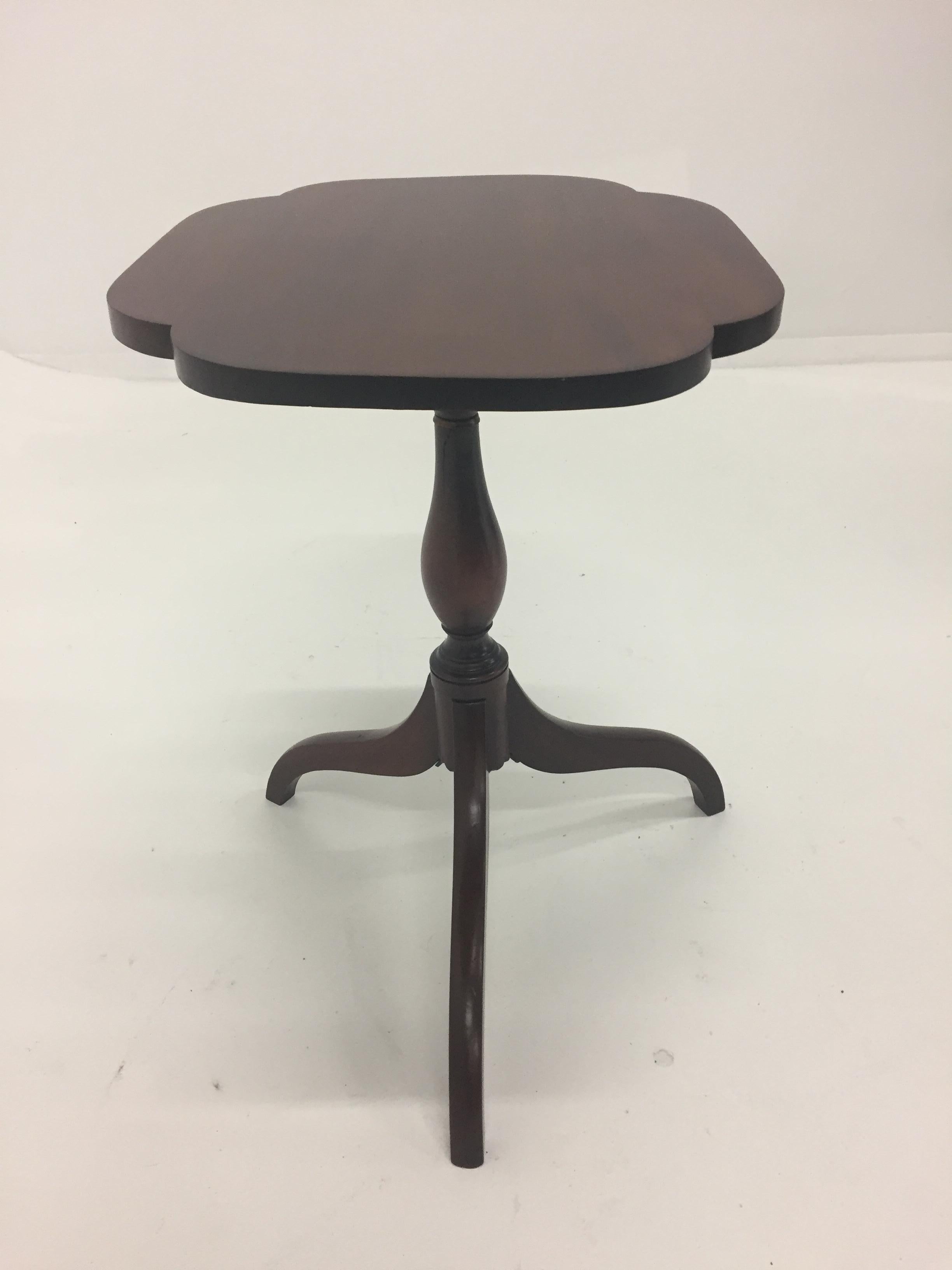Lovely classic English mahogany tilt top side table having a pretty scalloped top and elegant column base with tripod legs.
When top is tilted up measures 36 H.