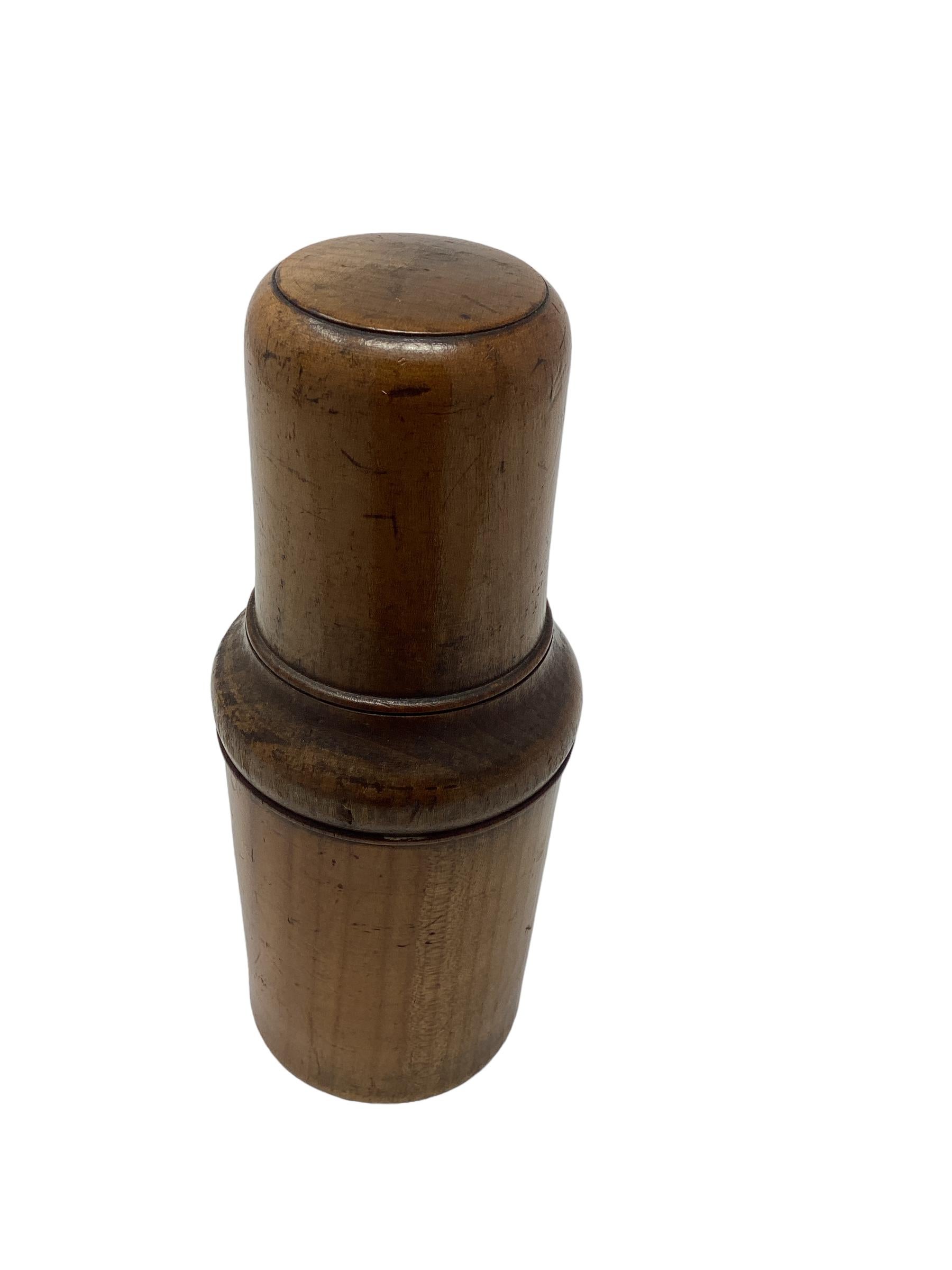 Antique English Treenware Flask or Bottle with Shot Glass. The top unscrews to reveal a glass flask and shot glass. The primary purpose of these antique treenware flasks or bottles with shot glasses was to provide a portable and convenient way to