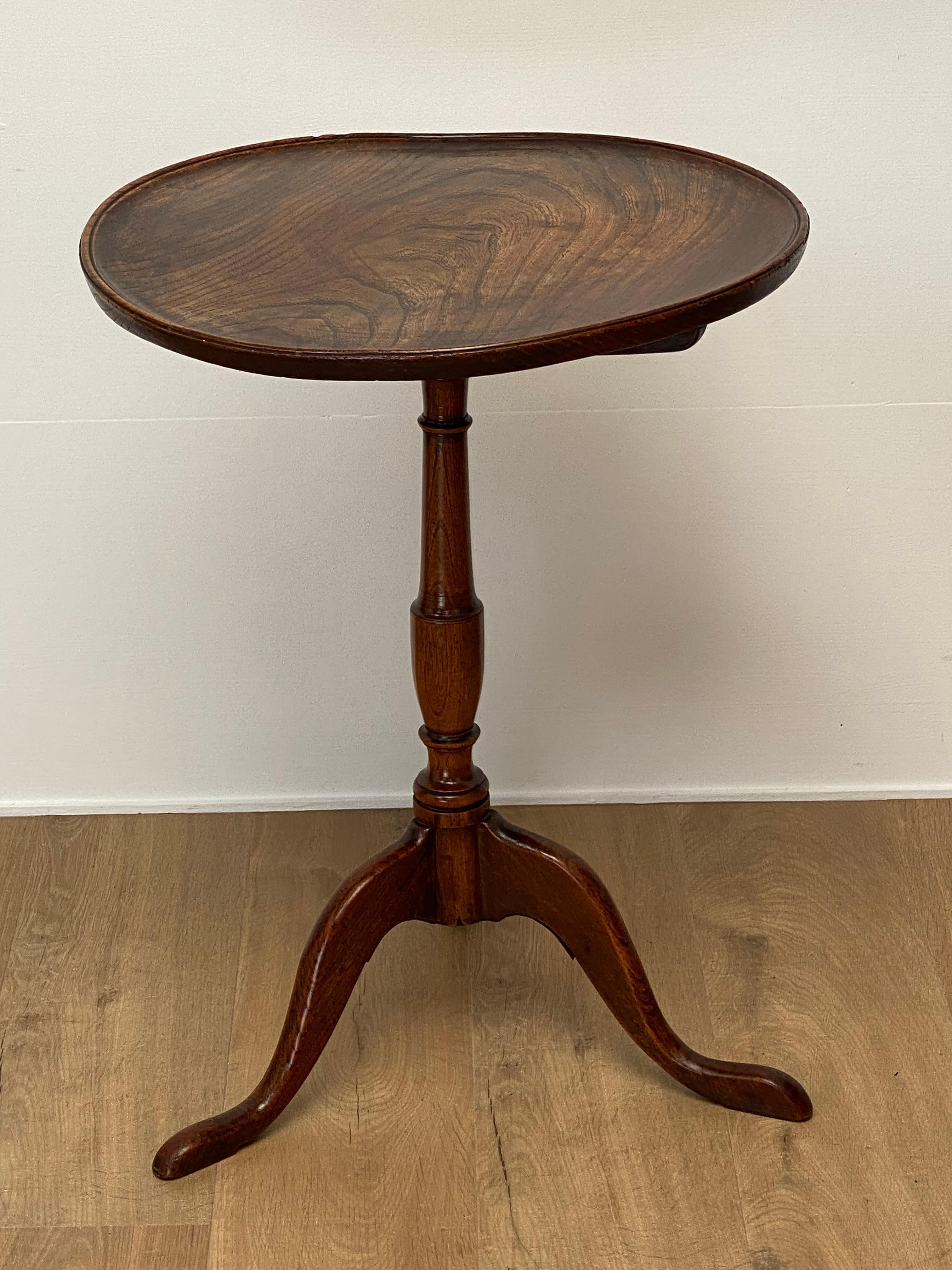 Antique , English unusual Elm Tripod Table,
18 Century, the top of the table is waving due to age,
great and warm, old patina of the Elm wood,
small table with a lot of caracter