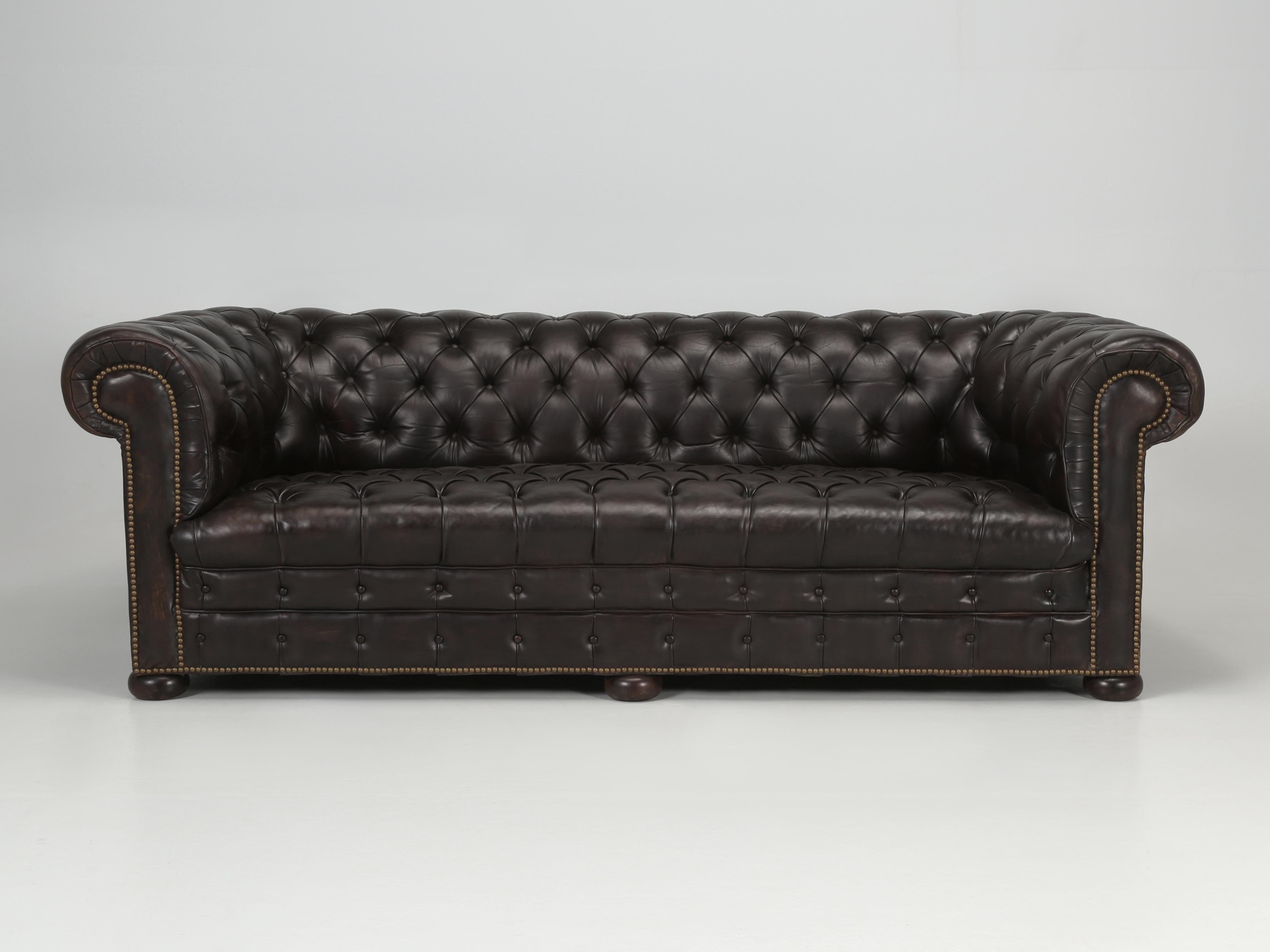 Antique English Leather Chesterfield Sofa that just emerged out of our inhouse Old Plank Upholstery Department, after a very long and exhausted stay. Restoring or conserving an old leather is truly a dying Art and very few shops today have the