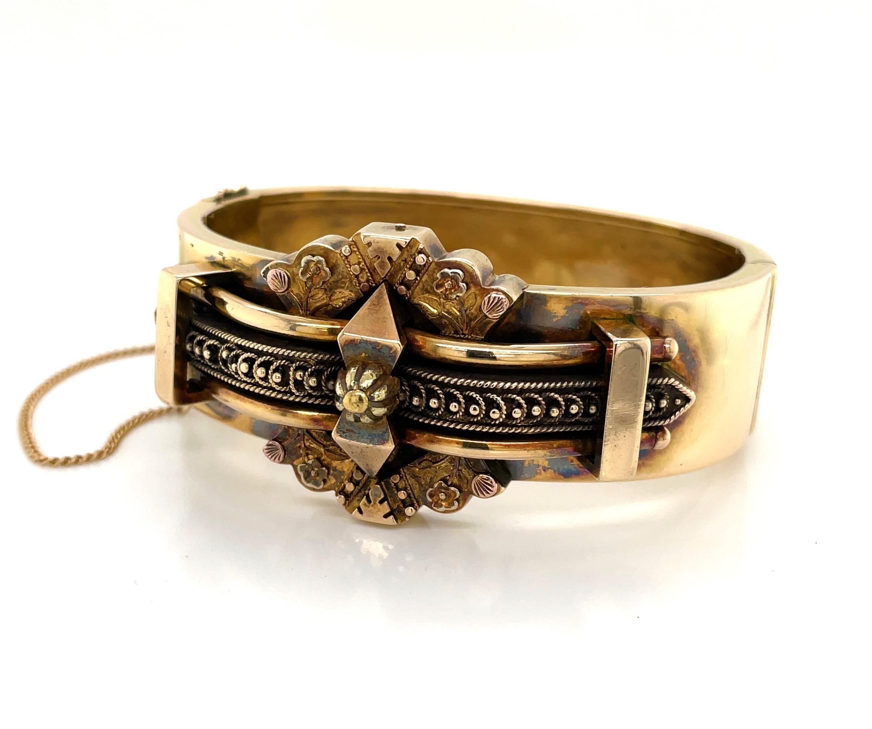 Ornately sculptured in fourteen karat (14K) yellow gold, this Victorian English bracelet is a real find. A 19th century estate piece, this stunning period bracelet has an acquired antique toned finish which is original and intentionally left
