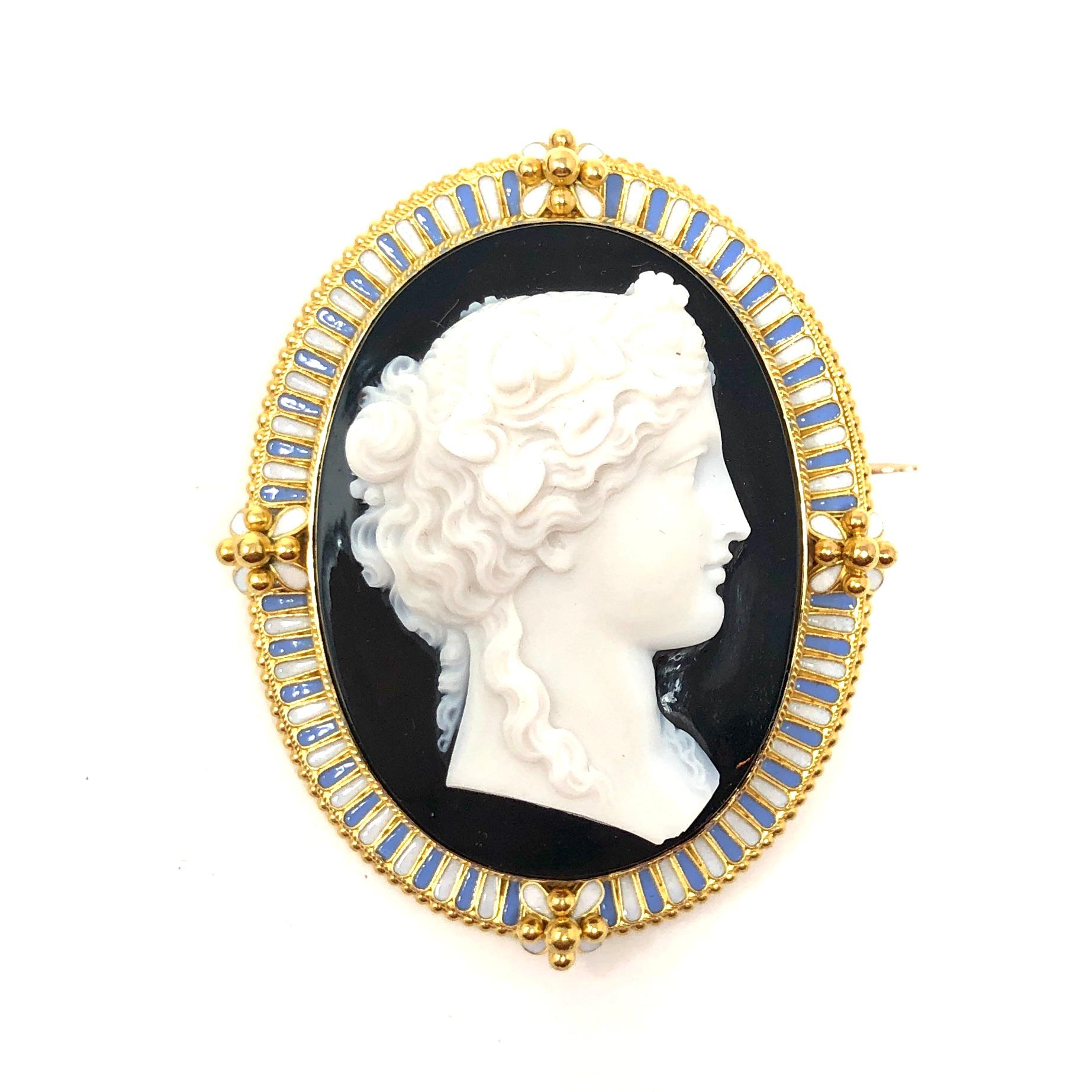 Magnificent quality Victorian parure in its original fitted box from Harry Emanuel wholesale diamond merchant. The set consists of a brooch, a pendant, and a pair of pierced earrings. Each piece is contains an expertly carved hard stone cameo set in