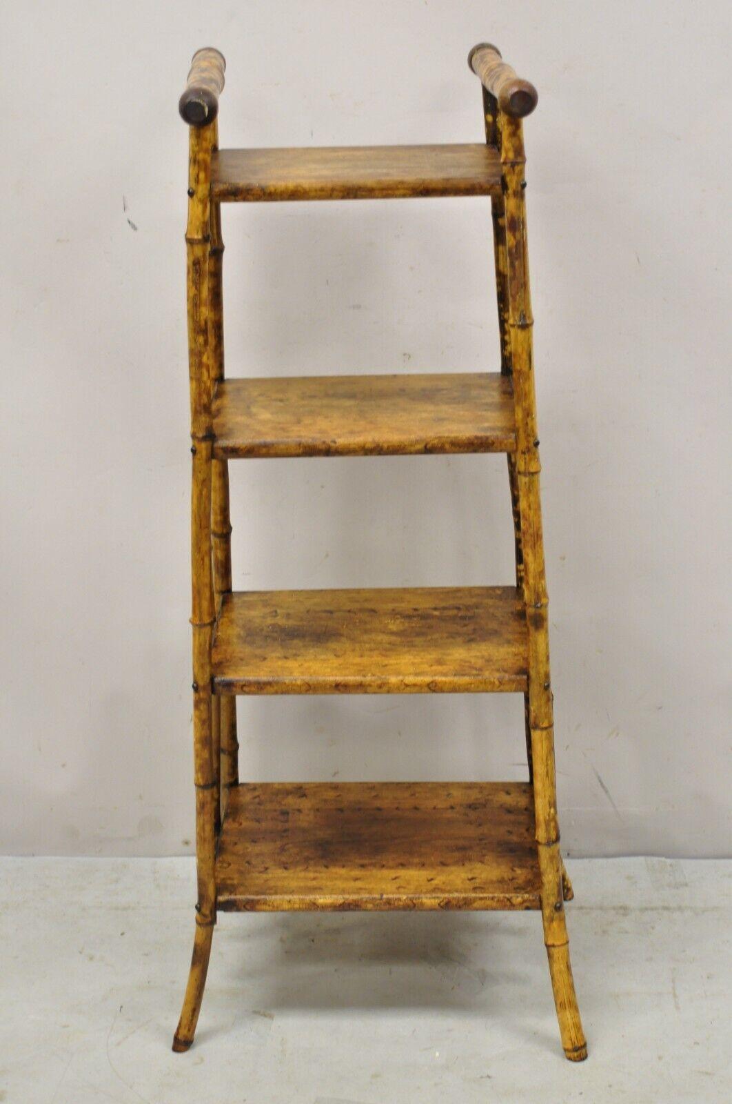 Antique English Victorian bamboo 4 tier angled curio etagere shelf. Item featured is bamboo construction, 4 tiers, shapely angled form, very nice antique item, quality English craftsmanship. circa 1900. Measurements: 44.5
