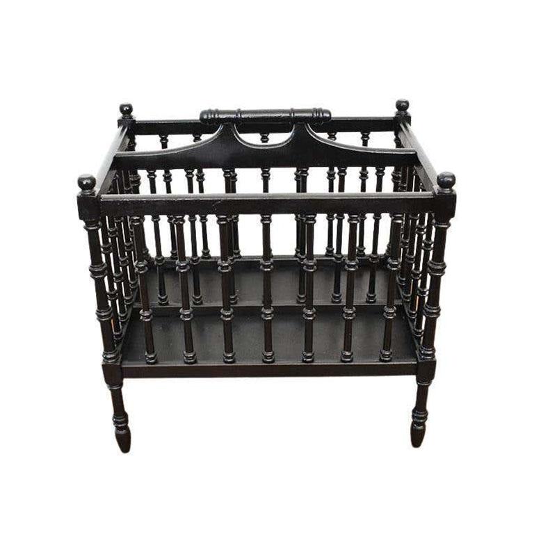 A tall black painted stick and ball magazine rack with handle. This beautiful antique will be gorgeous in a living room to organize magazines and catalogs. 

Dimensions:
19