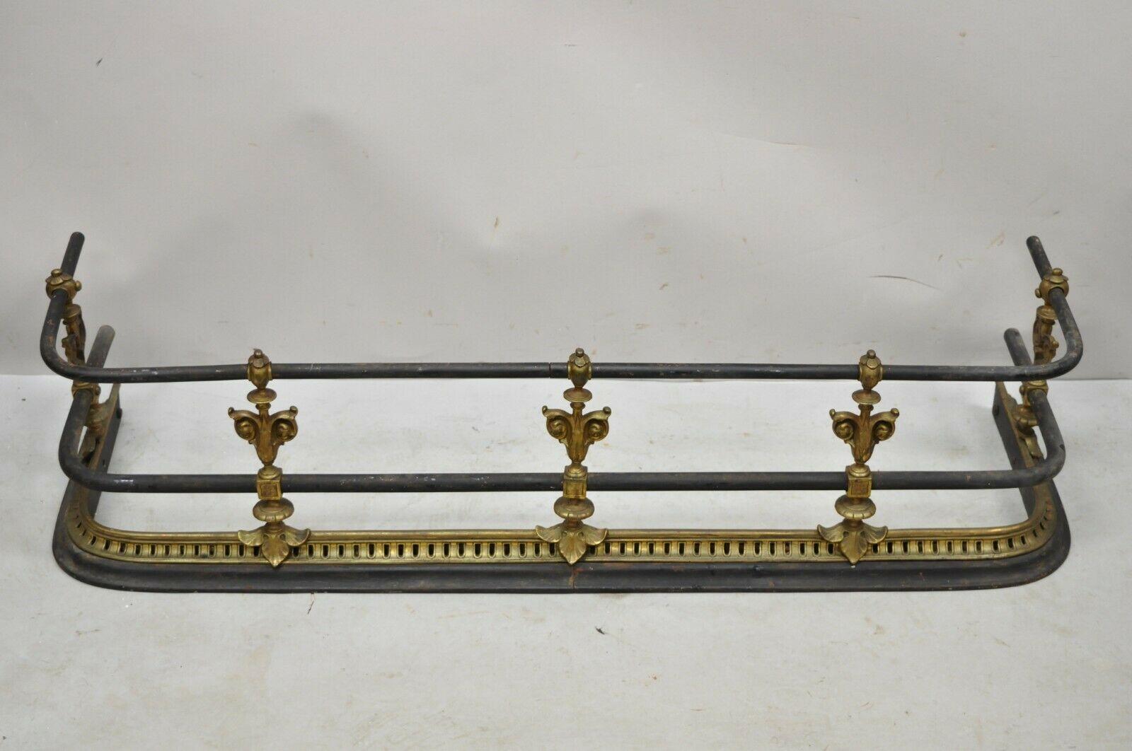 Antique English Victorian brass cast iron leaf scroll fireplace surround fender. item features wonderful aged patina, very nice antique item, quality craftsmanship, great style and form. Circa 19th Century. Measurements: 10.5