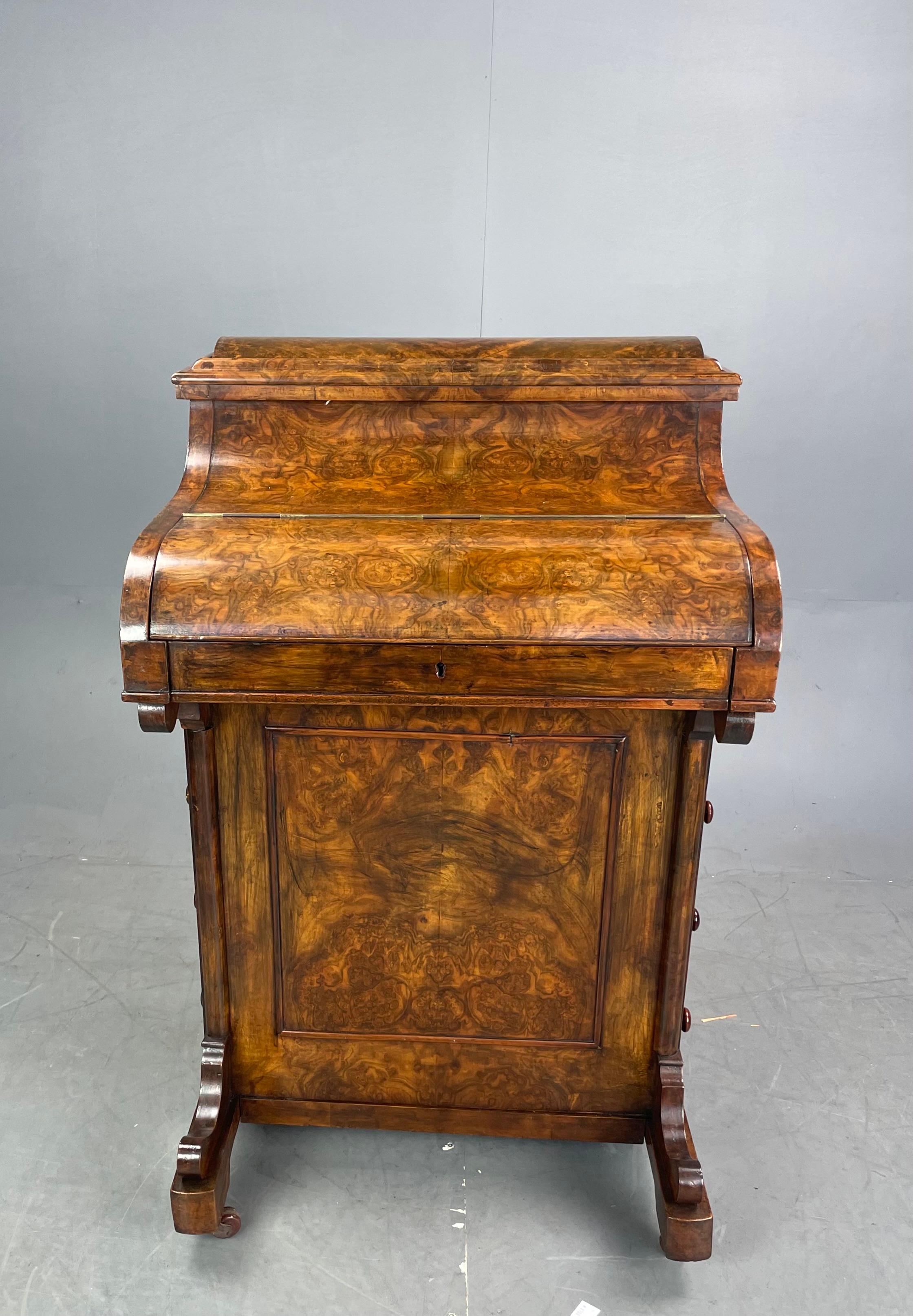 Victorian burr walnut pop up Davenport.
The Davenport has a slide out writing surface with original Moroccan leather insert .with stationary storage underneath with a pen slide .revealing the secret lever to activate the pop up stationary box