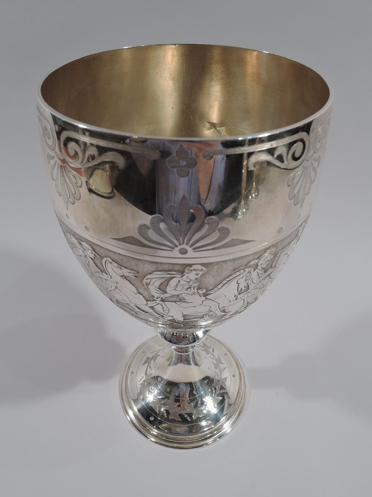 Victorian classical sterling silver goblet. Made by Barnard & Sons in London in 1872. Oval bowl on flanged and knopped shaft flowing into stepped and raised foot. Acid-etched equestrian frieze between stylized palmette borders. Circular cartouche