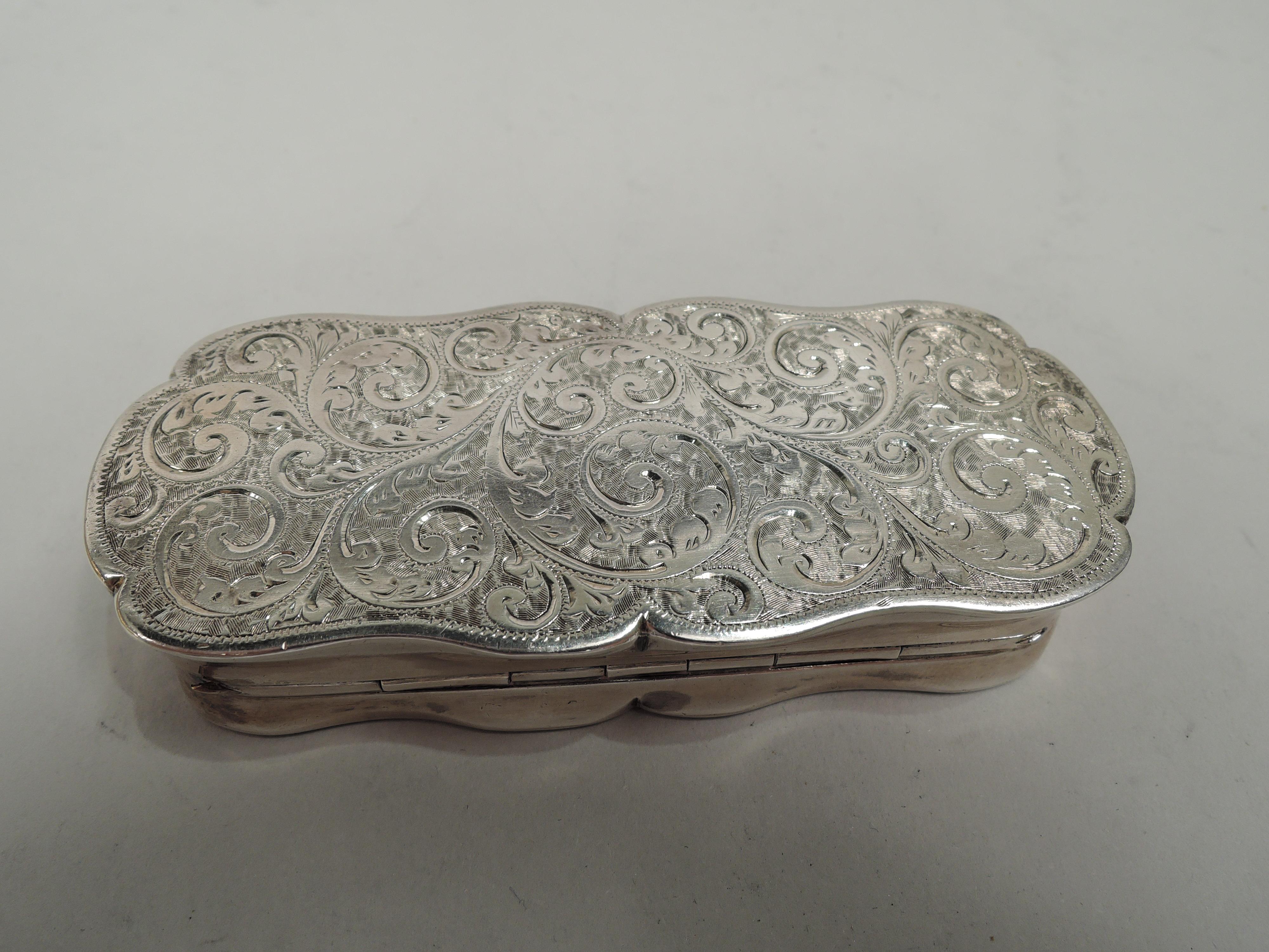 Victorian Classical sterling silver snuffbox. Made by Joseph Gloster, Ltd in Birmingham in 1896. Tubular with concave sides and scrolled rims. Cover hinged with straight tab. Leafing scrollwork on cover top and underside; cover top has armorial