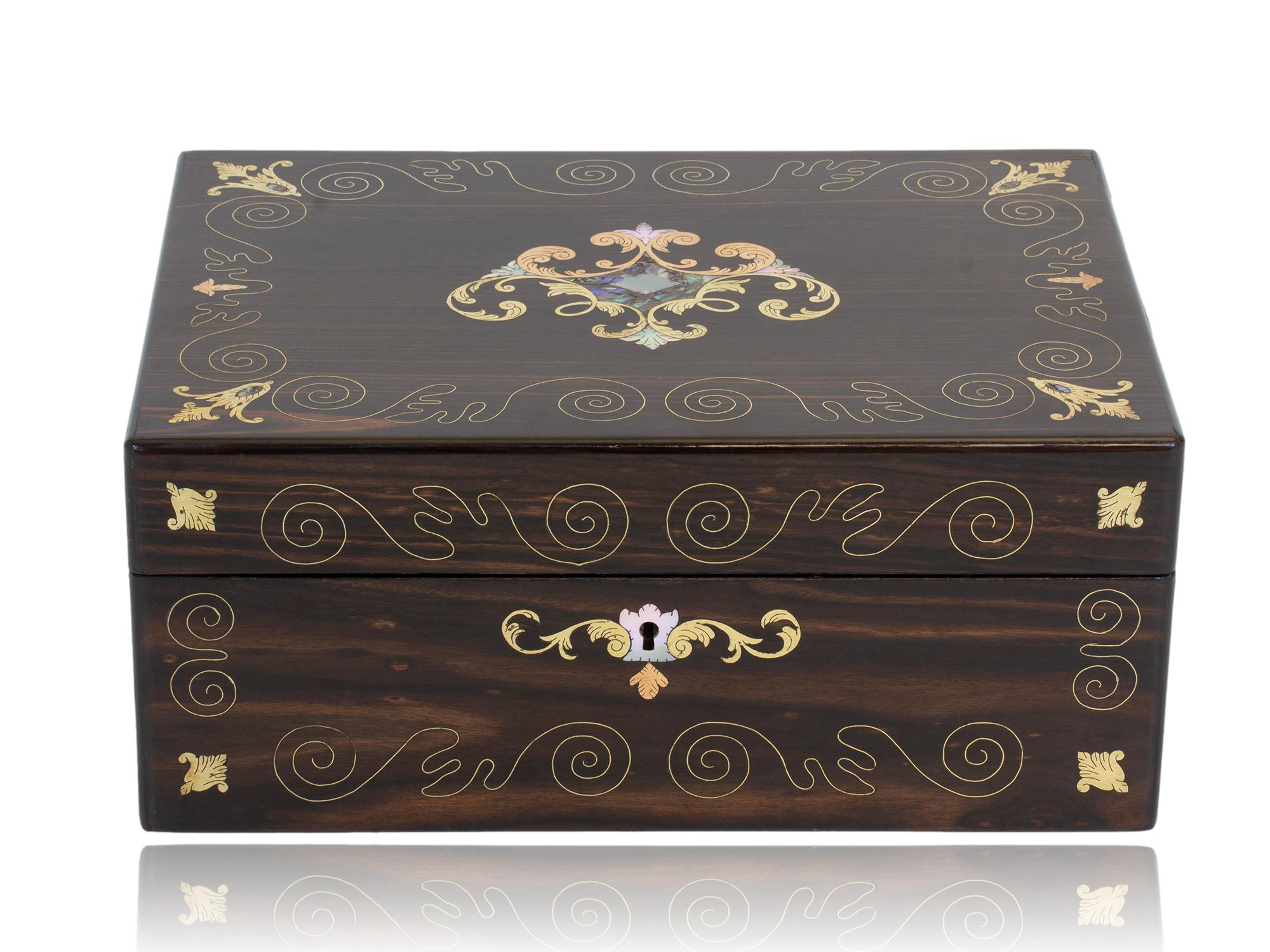 Victorian Circa 1875

From our Jewellery Box collection, we are pleased to offer this stunning Coromandel and Mother of Pearl Jewellery Box. The Jewellery Box of rectangular shape beautifully veneered in exotic Coromandel wood with delicate swirls