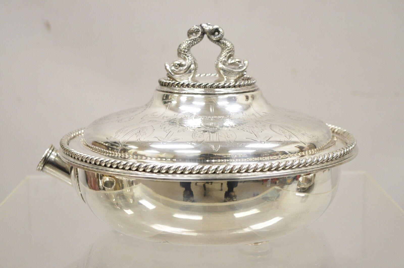 Antique English Victorian Figural Dolphin & Lion Crest Warming Tureen Serving Lidded Dish. Item features a lidded spout for adding hot water to keep the dish warm. Water settles in a separate section in the bottom of the dish. Figural twin dolphin