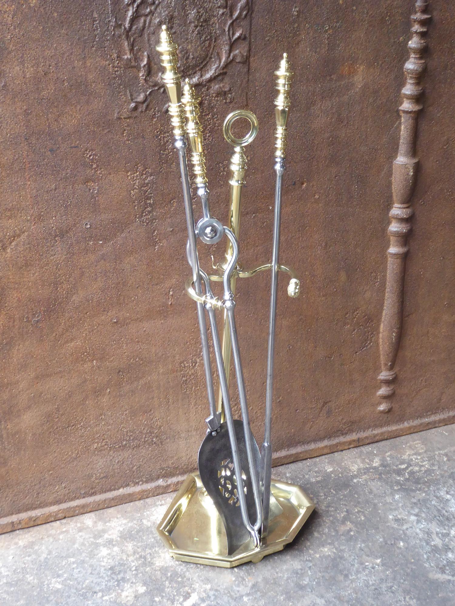 Tall and beautiful 19th century English Victorian fireplace tool set. The companion set of fire irons is made of polished brass and polished steel. It is in a good condition and is fully functional.

We have a unique and specialized collection of