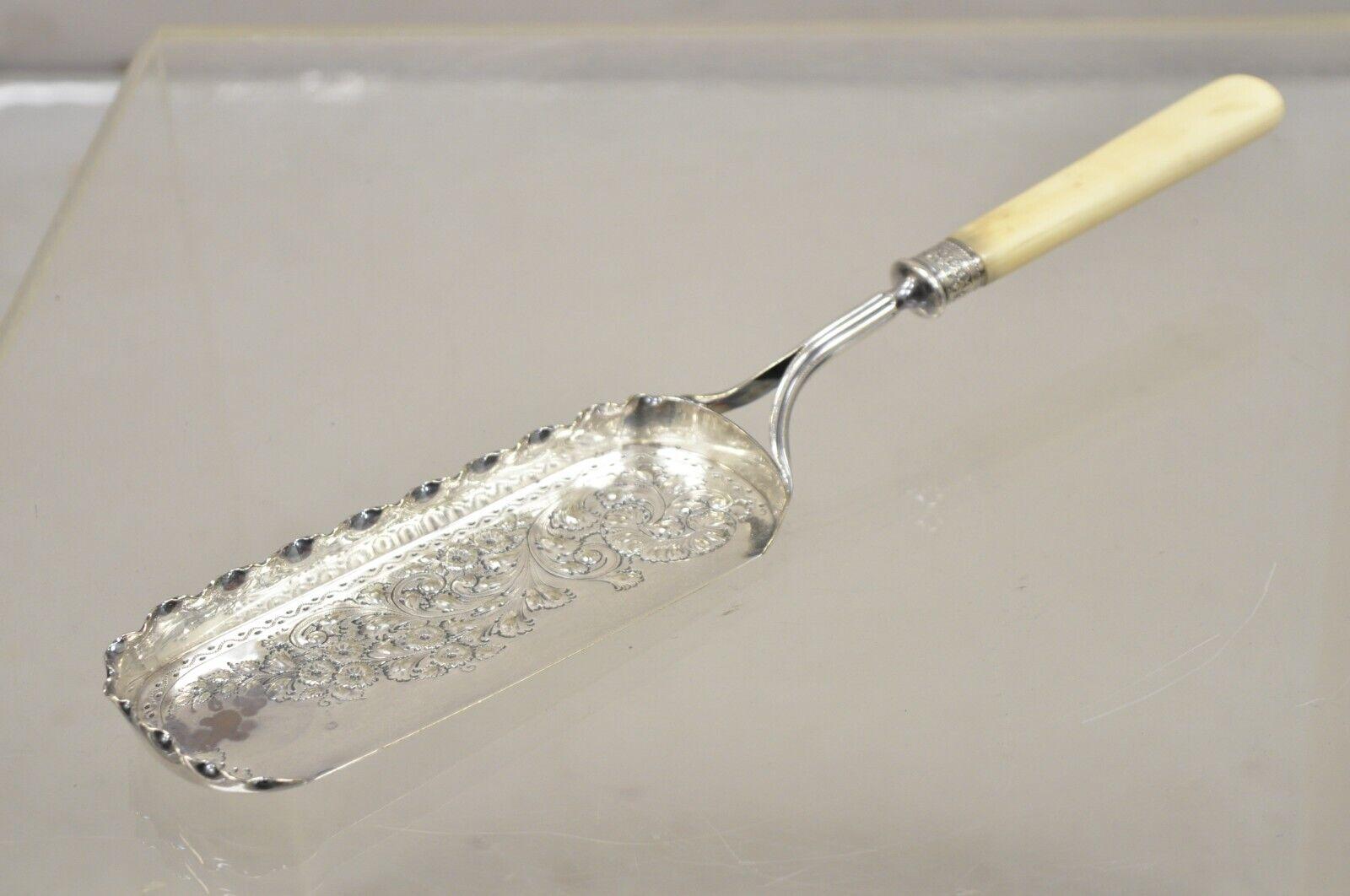 Antique English Victorian Floral Repousse Silver Plated Crumb Scoop Tray. Handle believed to be celluloid or bone, undetermined. 
Circa 1900. Measurements:  1.5
