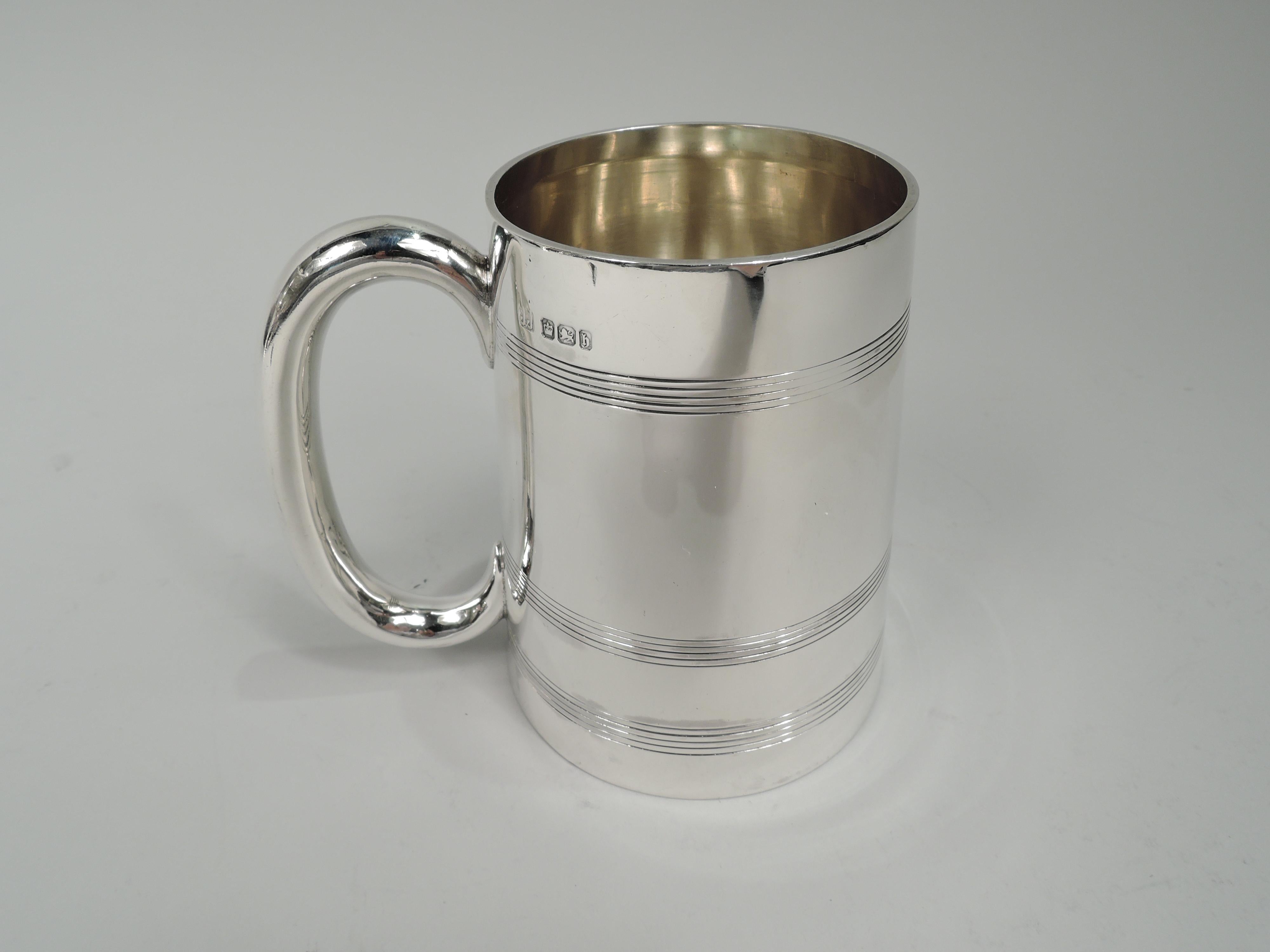 English Victorian Georgian sterling silver baby cup, 1900. Retailed by James Charles Jay in Oxford in 1900. Straight and upward tapering sides and c-scroll handle. Reeded bands. Old fashioned with plenty of room for engraving. Fully marked. Weight: