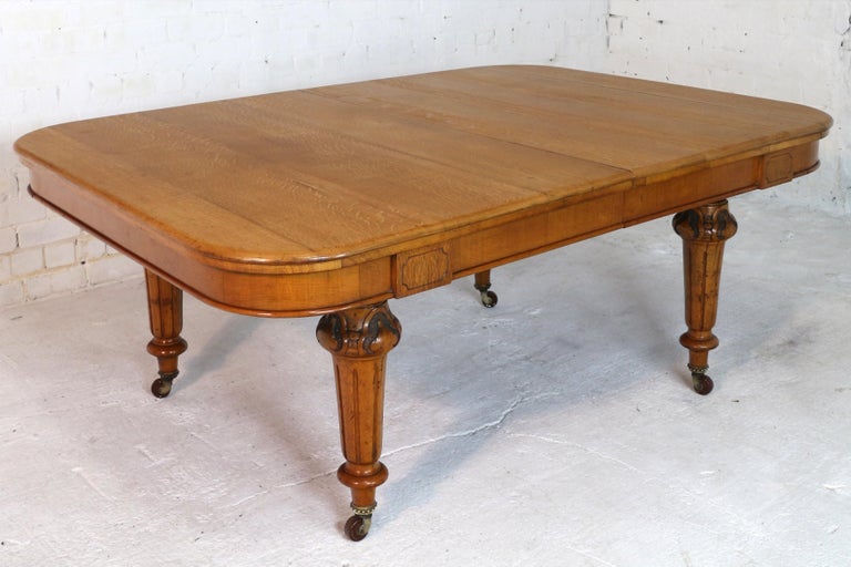 Antique English Victorian Golden Oak Extending Dining Table and Two