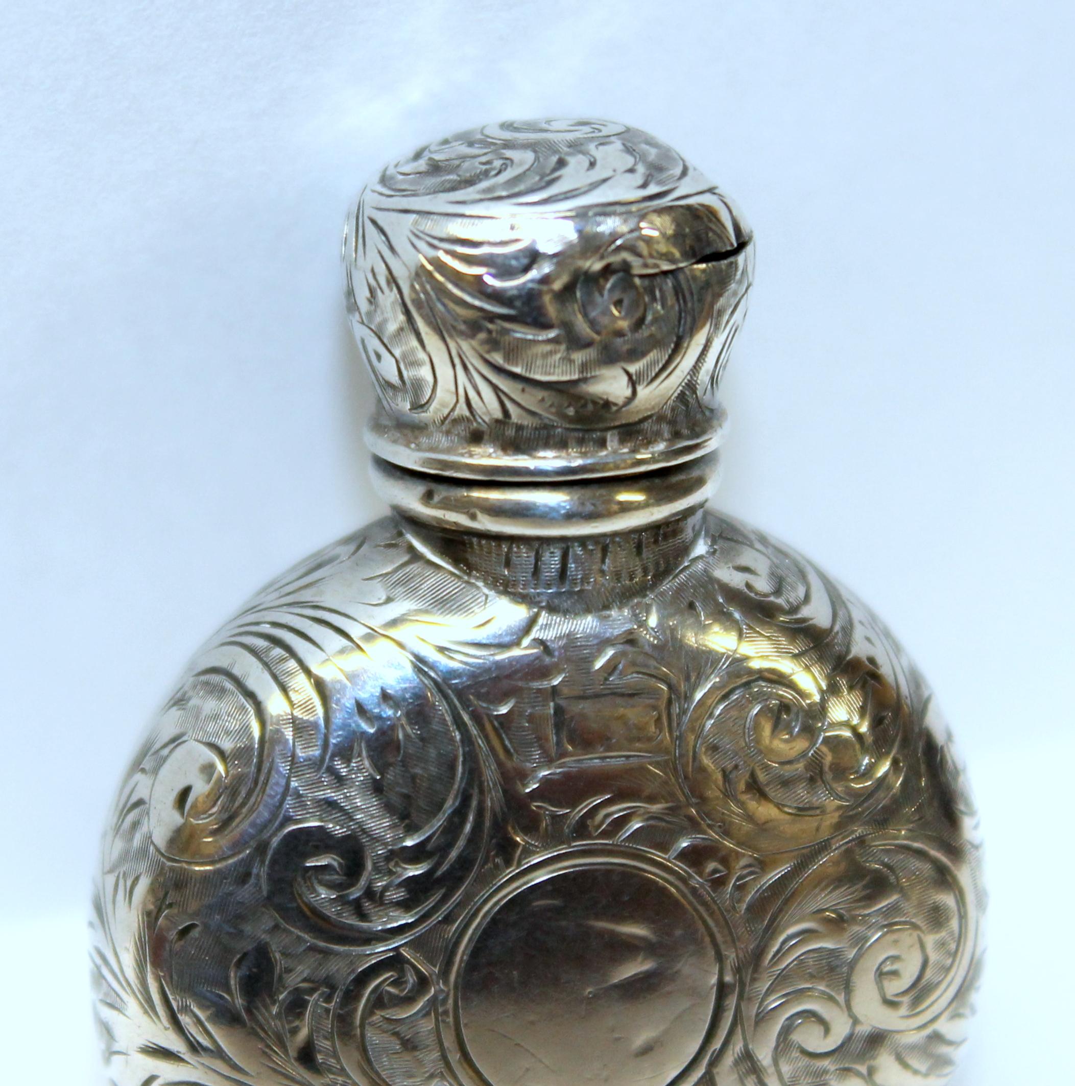 Rare and fine antique English Victorian hallmarked sterling hand engraved small round perfume or scent bottle
Hallmarked-Birmingham-1886/87, superbly hand engraved
A/F minor dings. Retains its original interior glass stopper.

 
