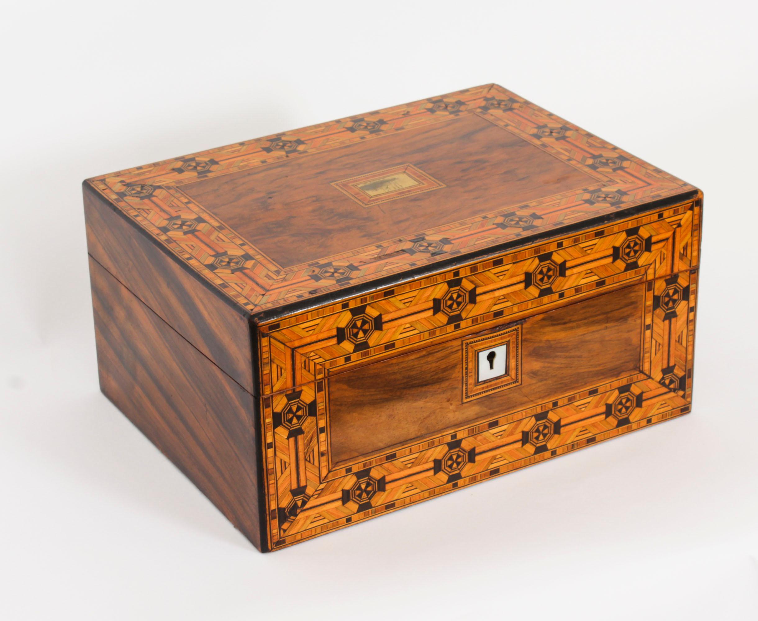 An Antique English Victorian inlaid tunbridge walnut jewellery casket, circa 1880 in date.

This splendid burr walnut casket is rectangular in shape and features luxurious tunbridge ware inlaid decoration.  The interior is lined with an Art Nouveau