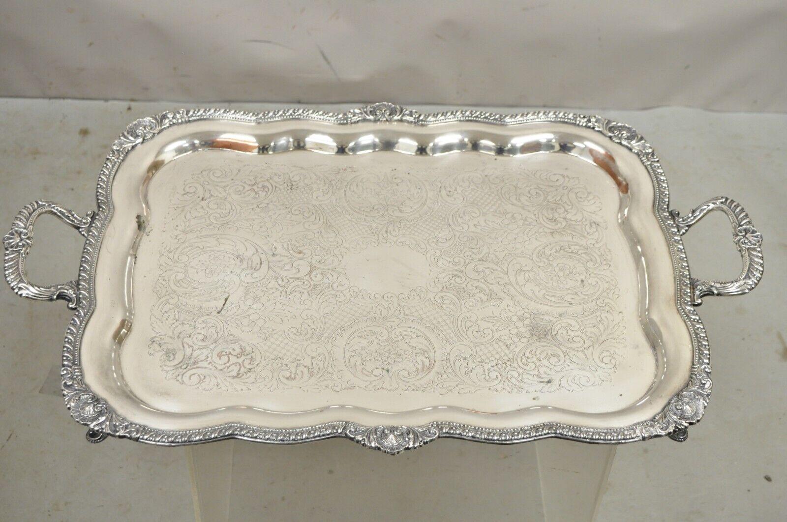 Antique English Victorian Large Silver Plated Scalloped Serving Platter Tray. Item featured is a large impressive size, raised on ornate feet, original hallmark, quality English craftsmanship. Circa Early to mid 20th Century. Measurements:  2