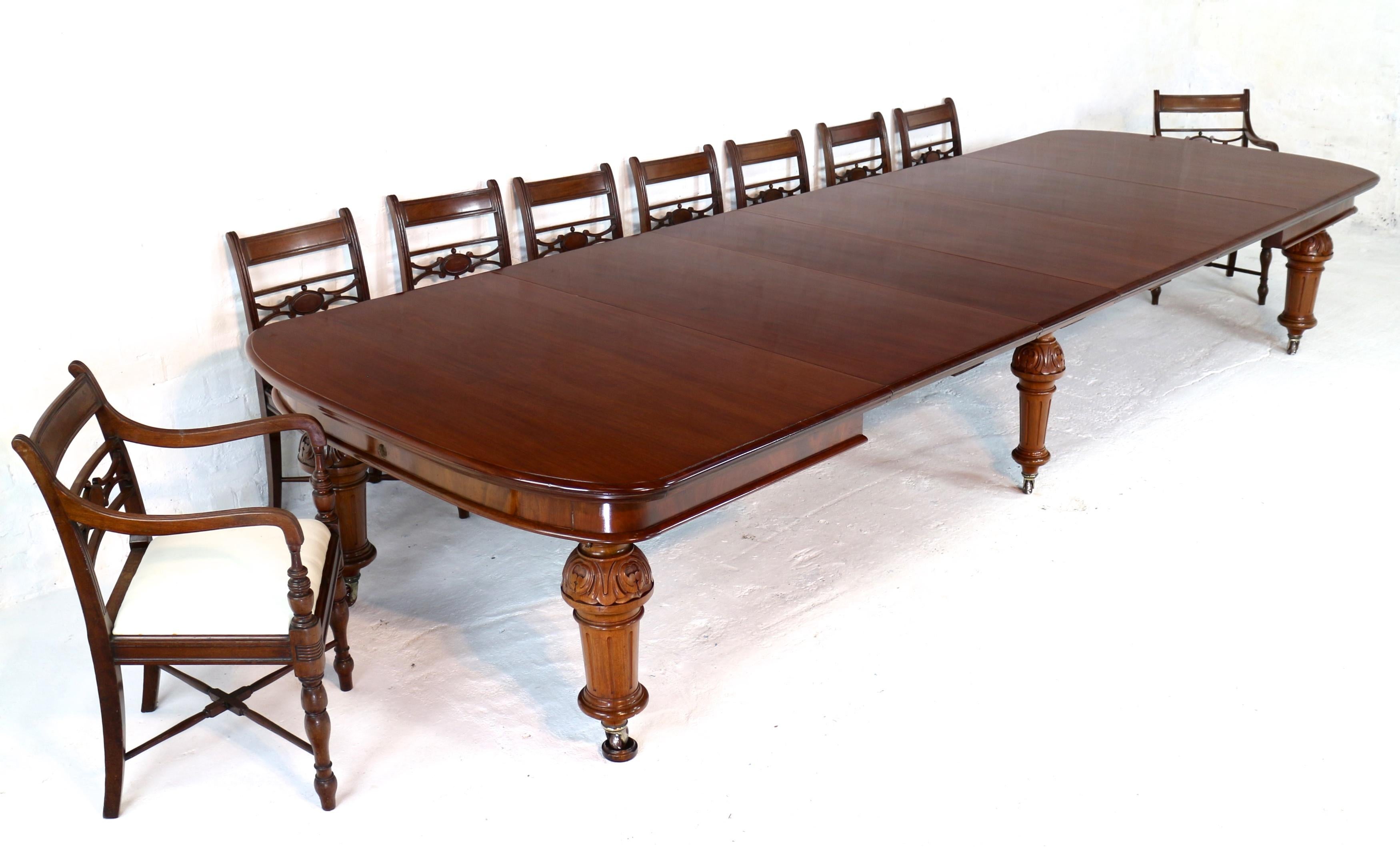 A super quality antique Victorian mahogany wind-out extending dining table with four additional leaves and standing on six substantial legs. This large 4ft9 wide table smoothly extends from 6ft to 13ft 8in by means of a double ‘screw expander’
