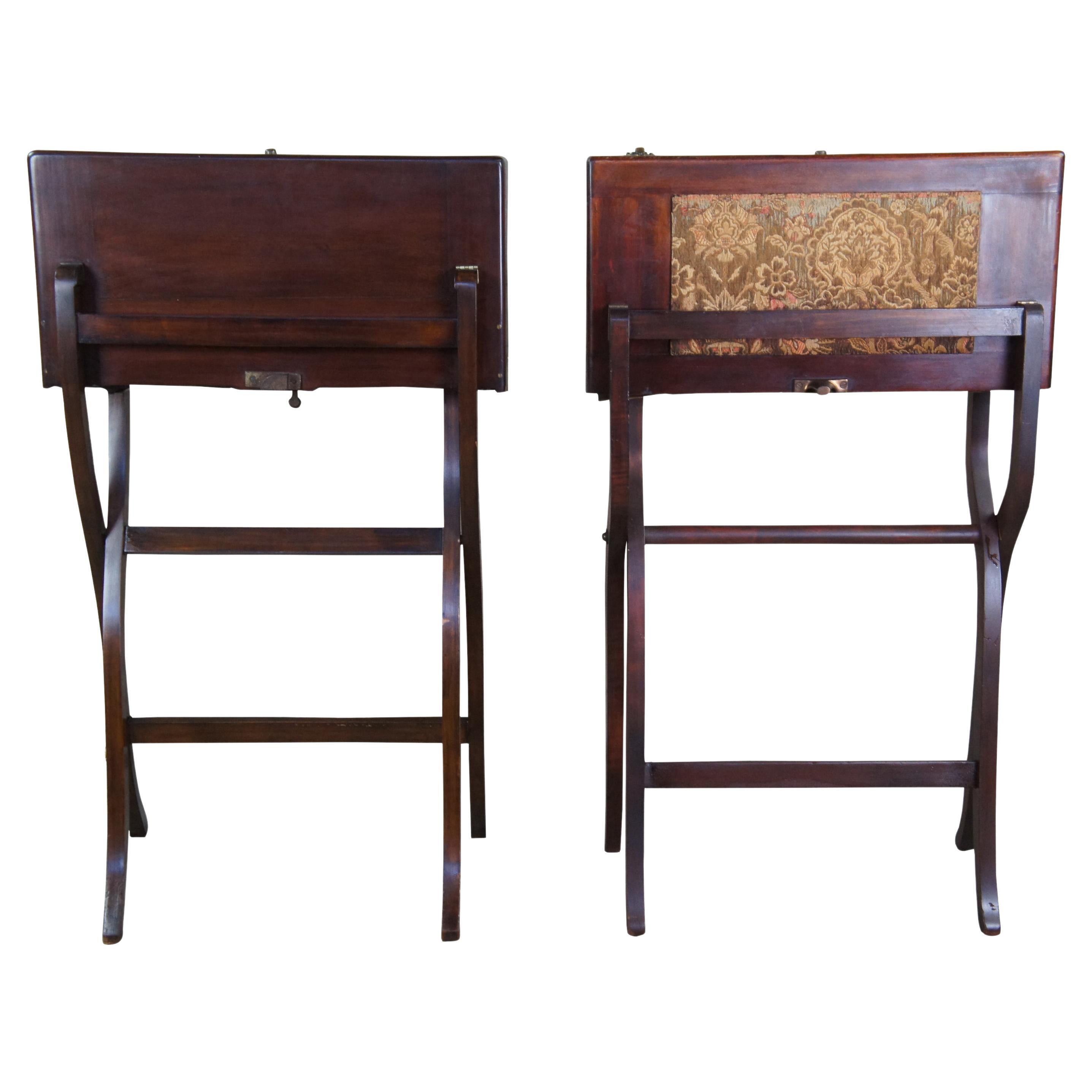 2 Civil War era British campaign writing desks.  Made of mahogany featuring a folding form that opens to a writing surface complete with inkwells and letter storage.  Slightly different forms and interiors, one boasting a needlepoint exterior